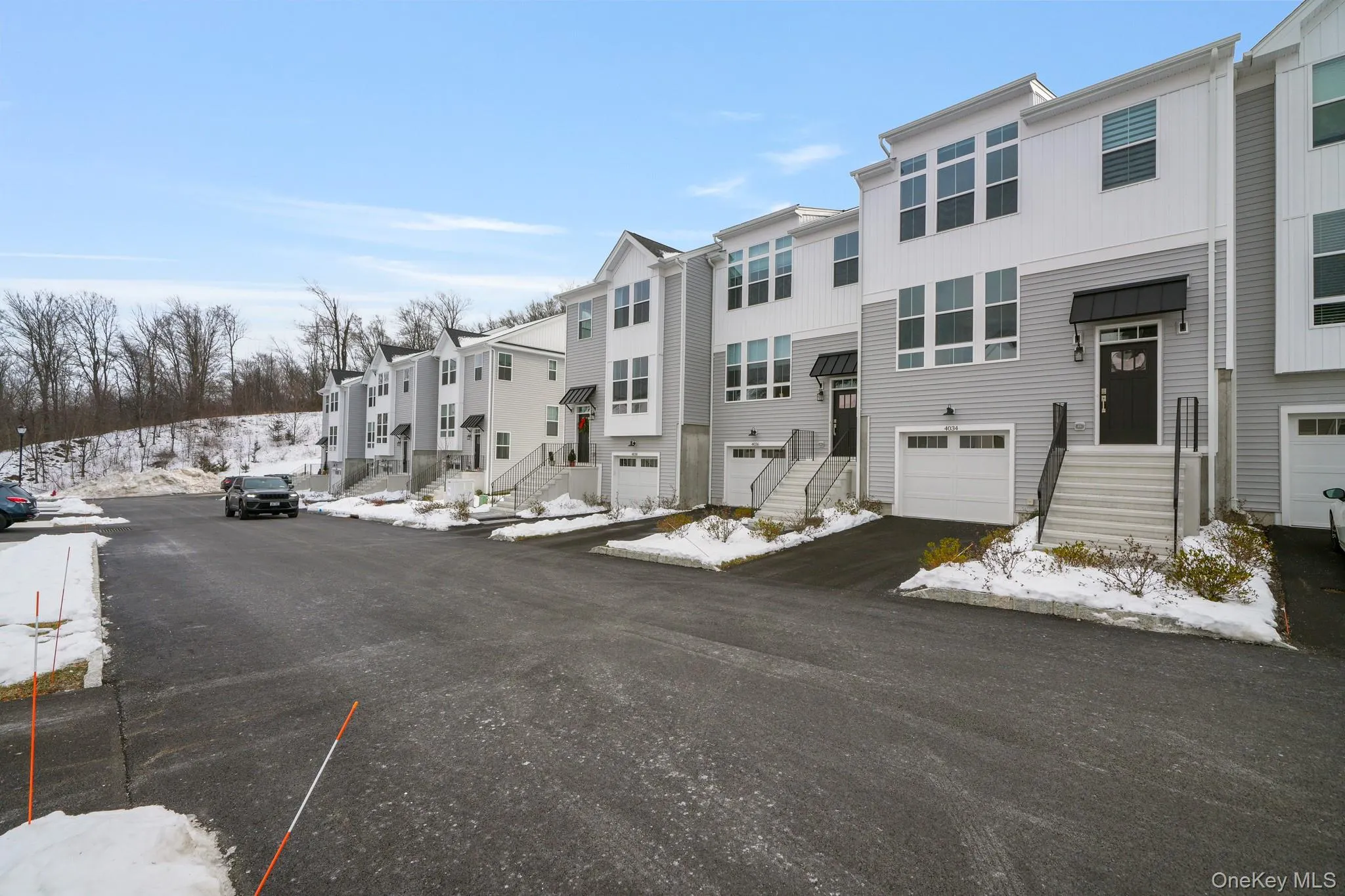View of asphalt street featuring a residential view View of asphalt street featuring a residential view