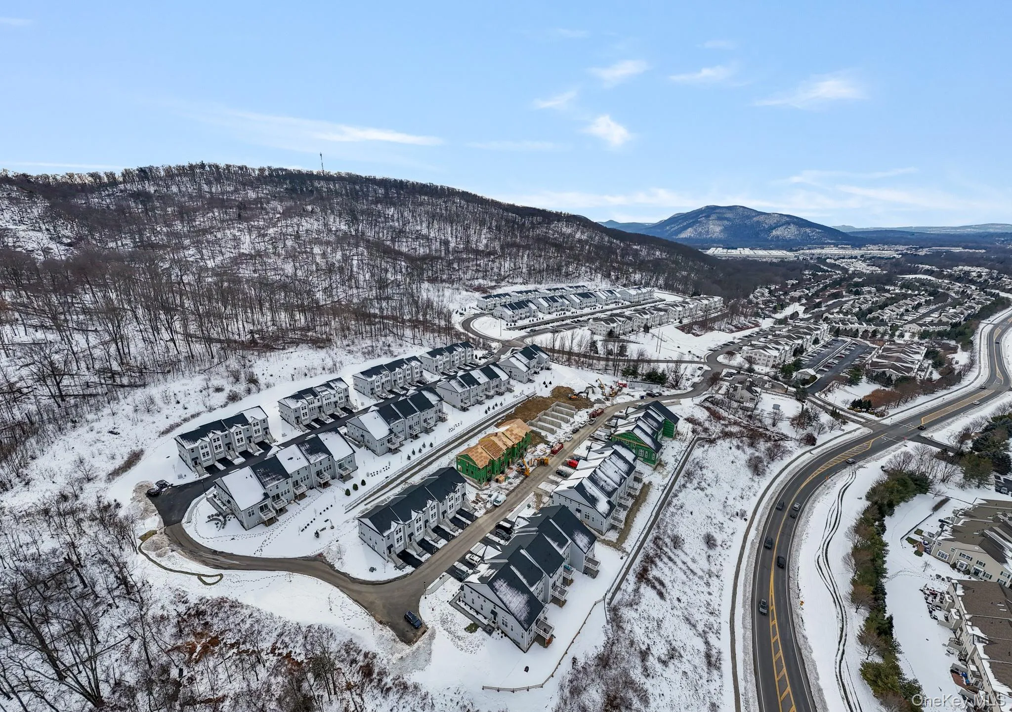 Snowy aerial view with a mountain view Snowy aerial view with a mountain view