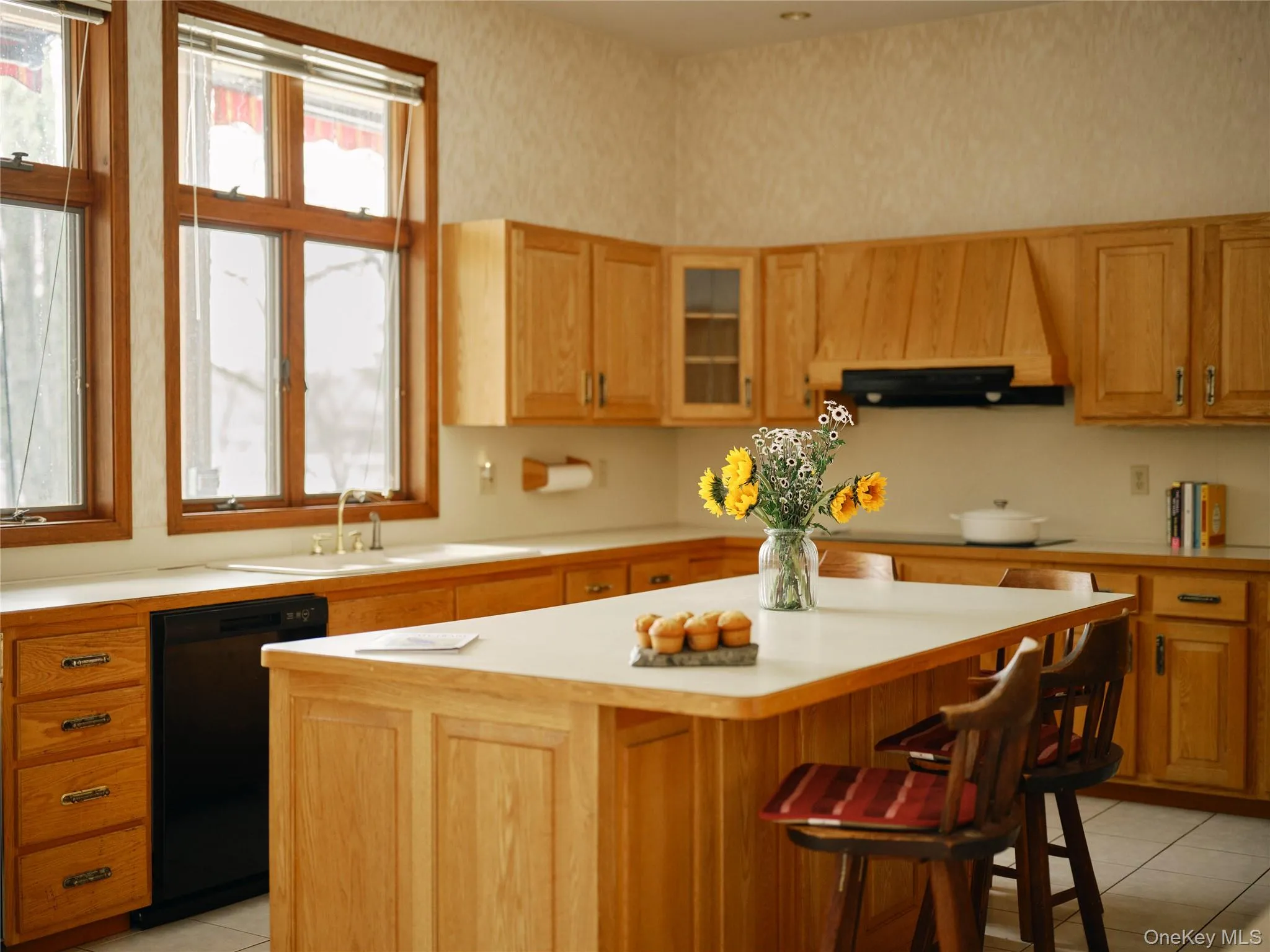 Kitchen featuring an island and lake view Kitchen featuring an island and lake view