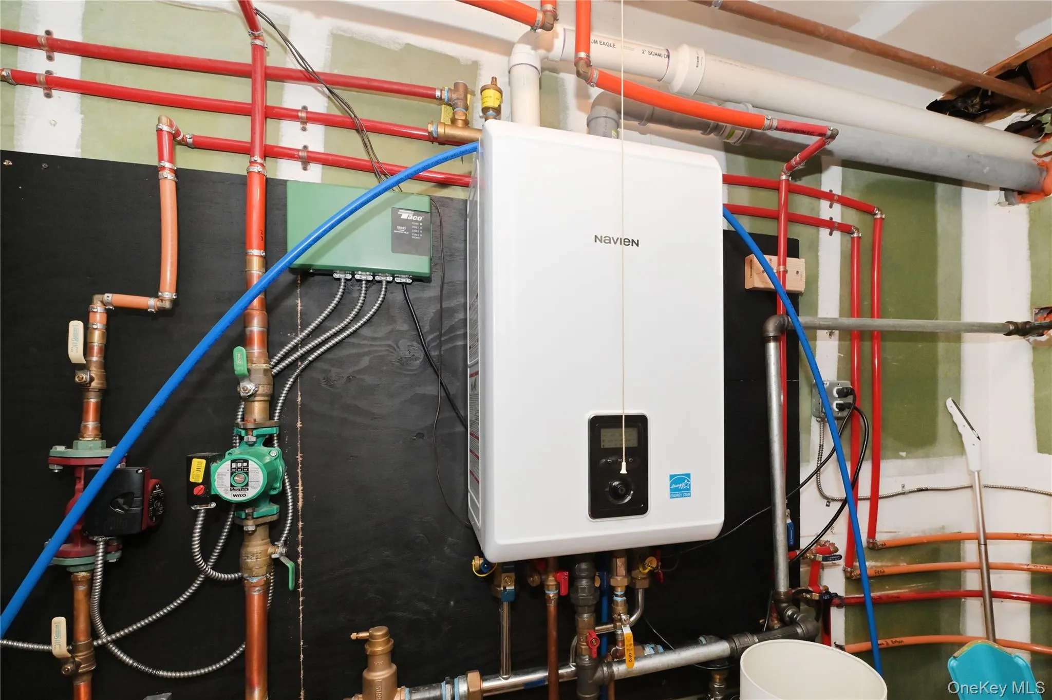 Utilities featuring tankless water heater Utilities featuring tankless water heater