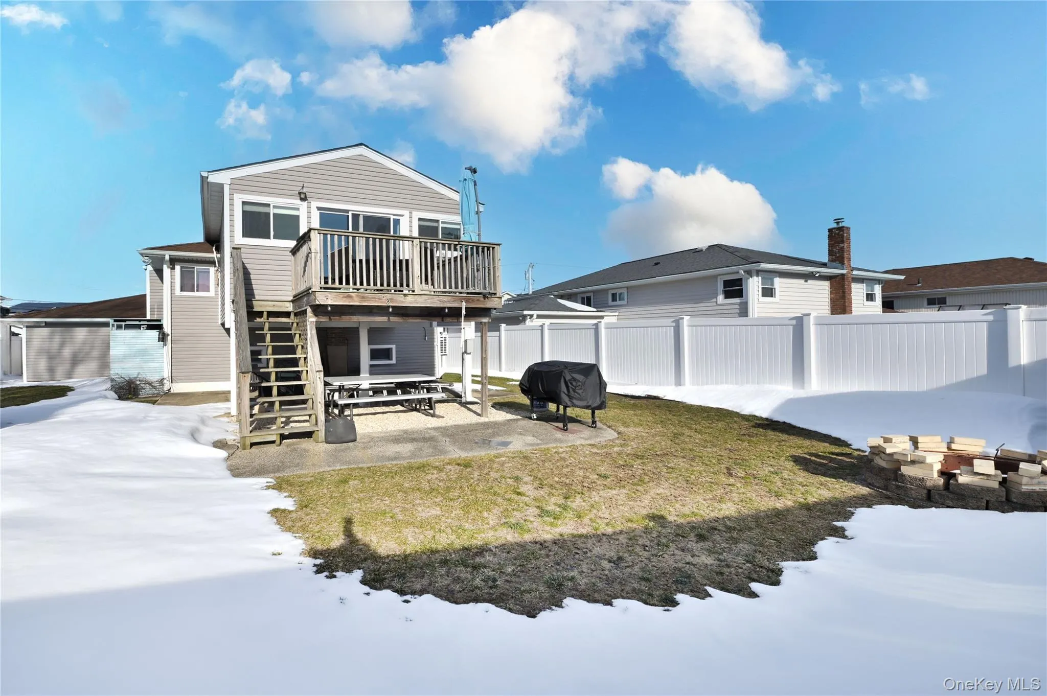 Rear view of property featuring a patio, a deck, and a fenced backyard Rear view of property featuring a patio, a deck, and a fenced backyard