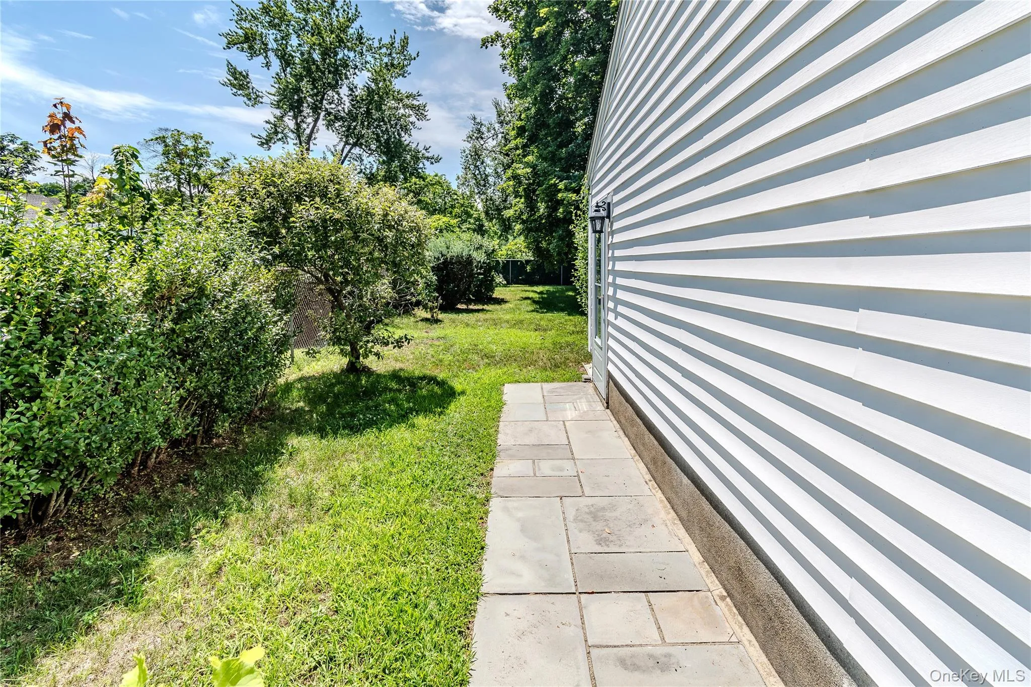 Garage-side walkway to back yard Garage-side walkway to back yard