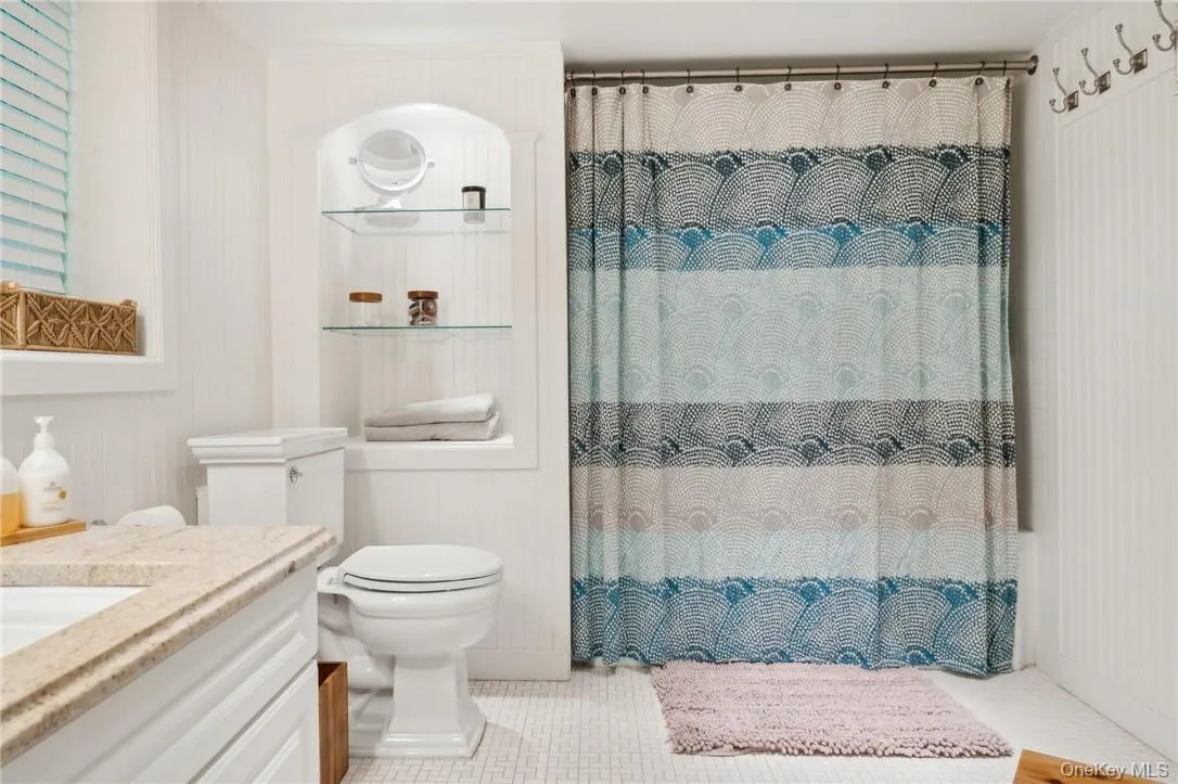 Bathroom featuring vanity and toilet Bathroom featuring vanity and toilet