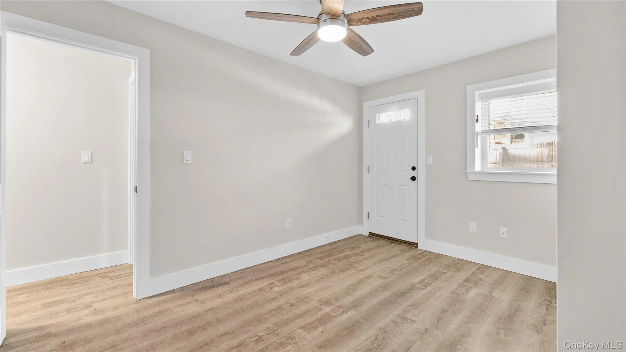 Primary bedroom with easy access to parking and rear yard. Primary bedroom with easy access to parking and rear yard.