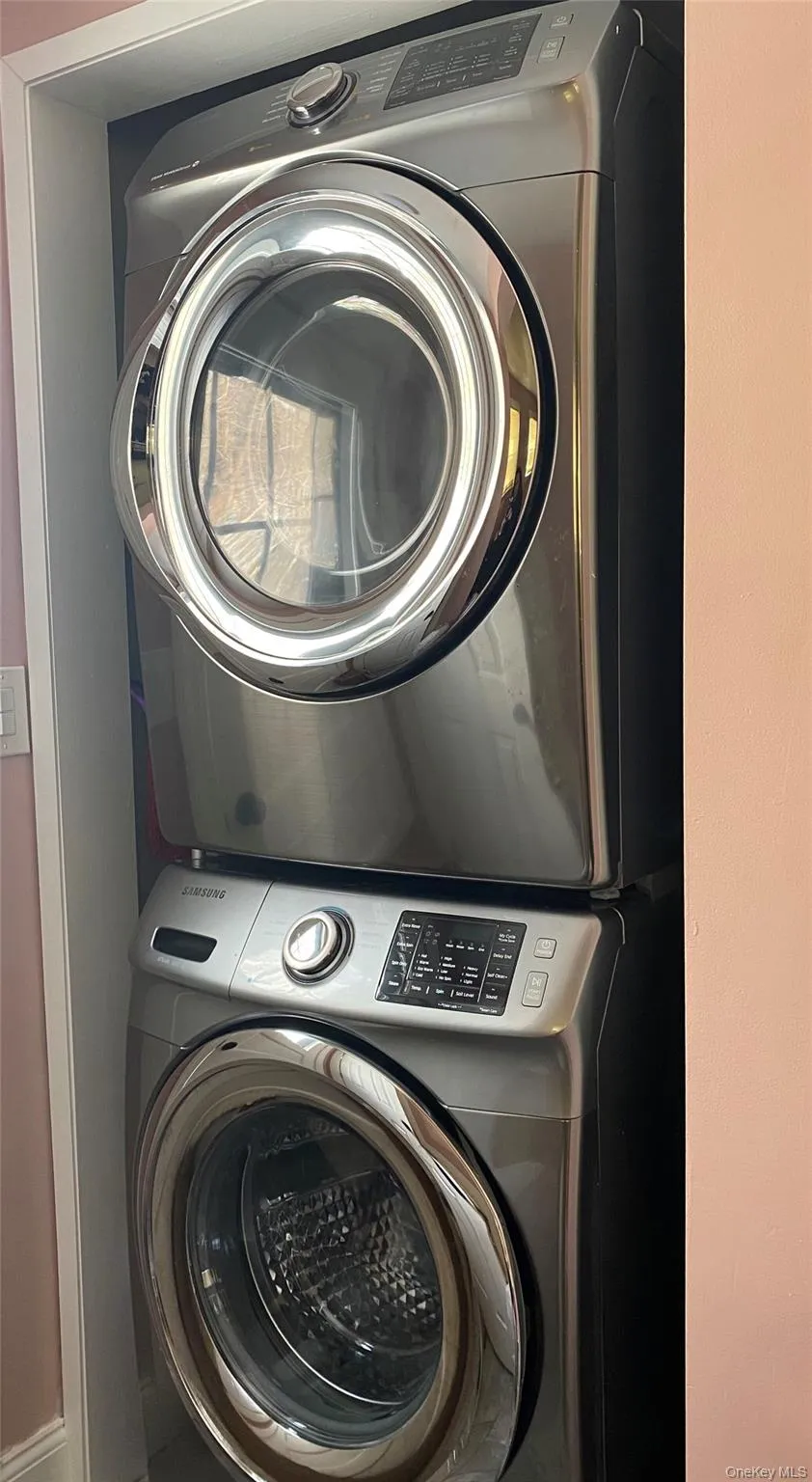 Laundry area with stacked washer and dryer Laundry area with stacked washer and dryer
