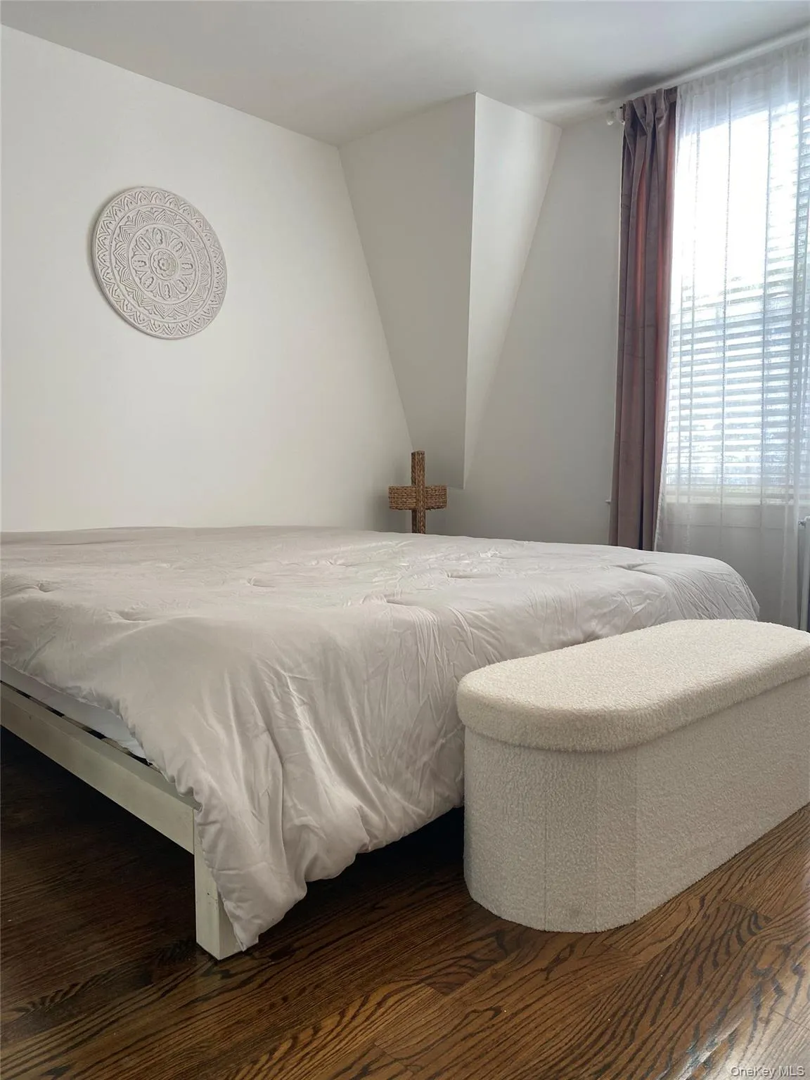 Primary bedroom with dark wood-type flooring Primary bedroom with dark wood-type flooring