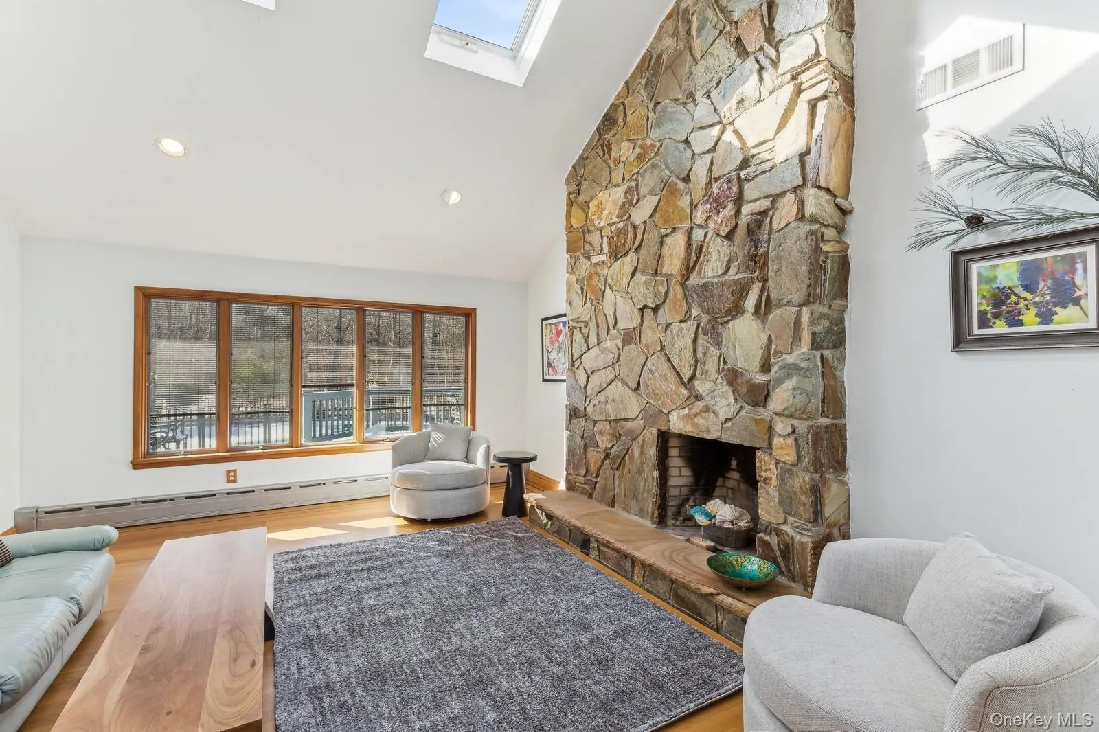 Living Room with Vaulted Ceiling and Fireplace - Photo 2 Living Room with Vaulted Ceiling and Fireplace - Photo 2