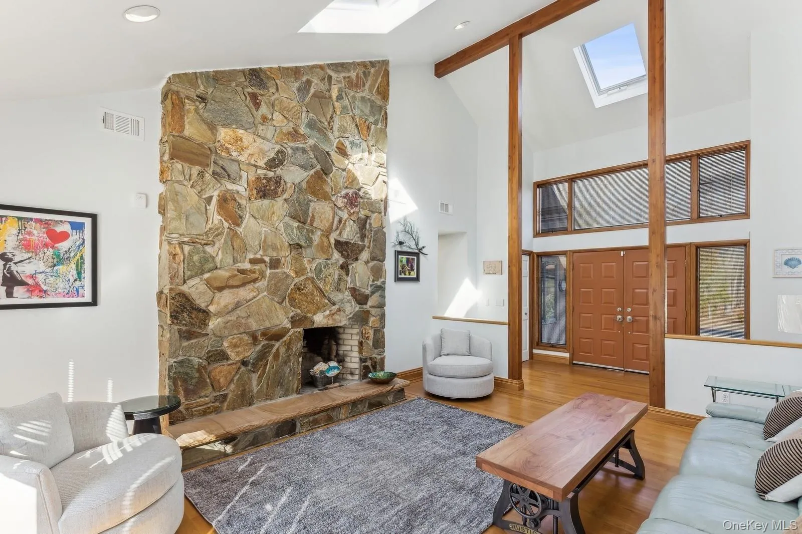 Living Room with Vaulted Ceiling and Fireplace - Photo 1 Living Room with Vaulted Ceiling and Fireplace - Photo 1