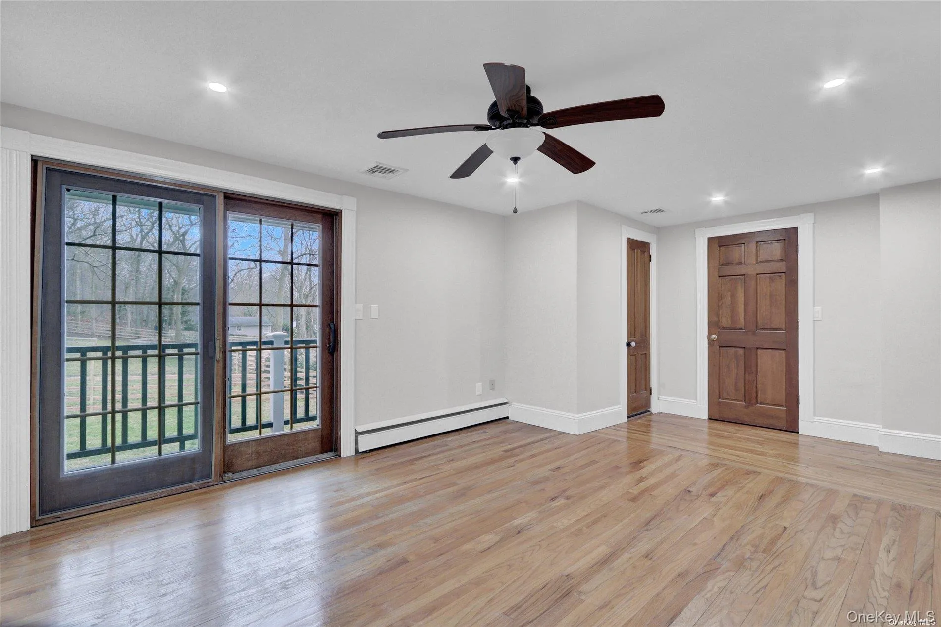 Primary Bedroom With Balcony & En-suite Bath Primary Bedroom With Balcony & En-suite Bath