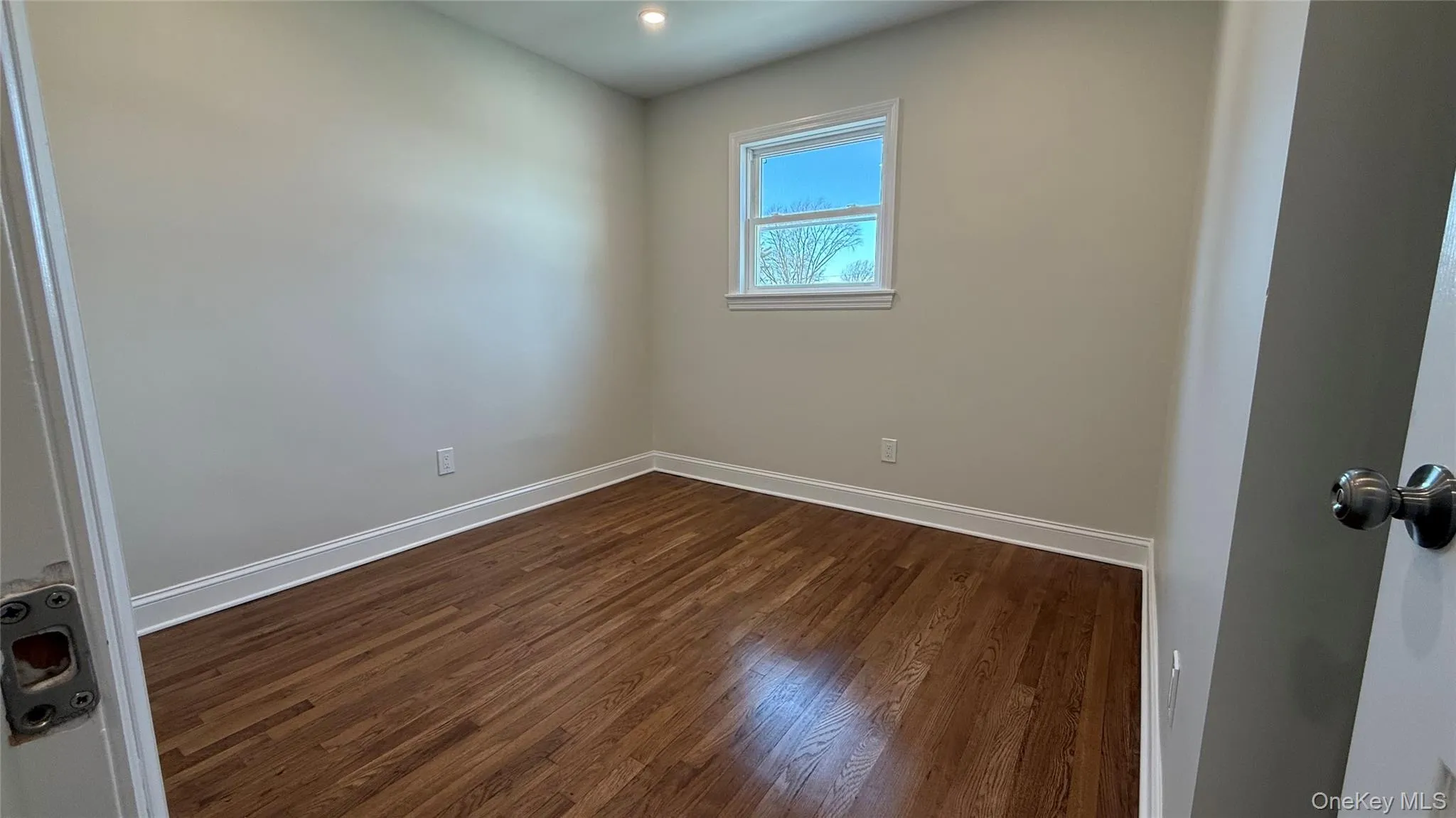 Bedroom (3) featuring recessed lighting, dark wood-style flooring, and a closet Bedroom (3) featuring recessed lighting, dark wood-style flooring, and a closet