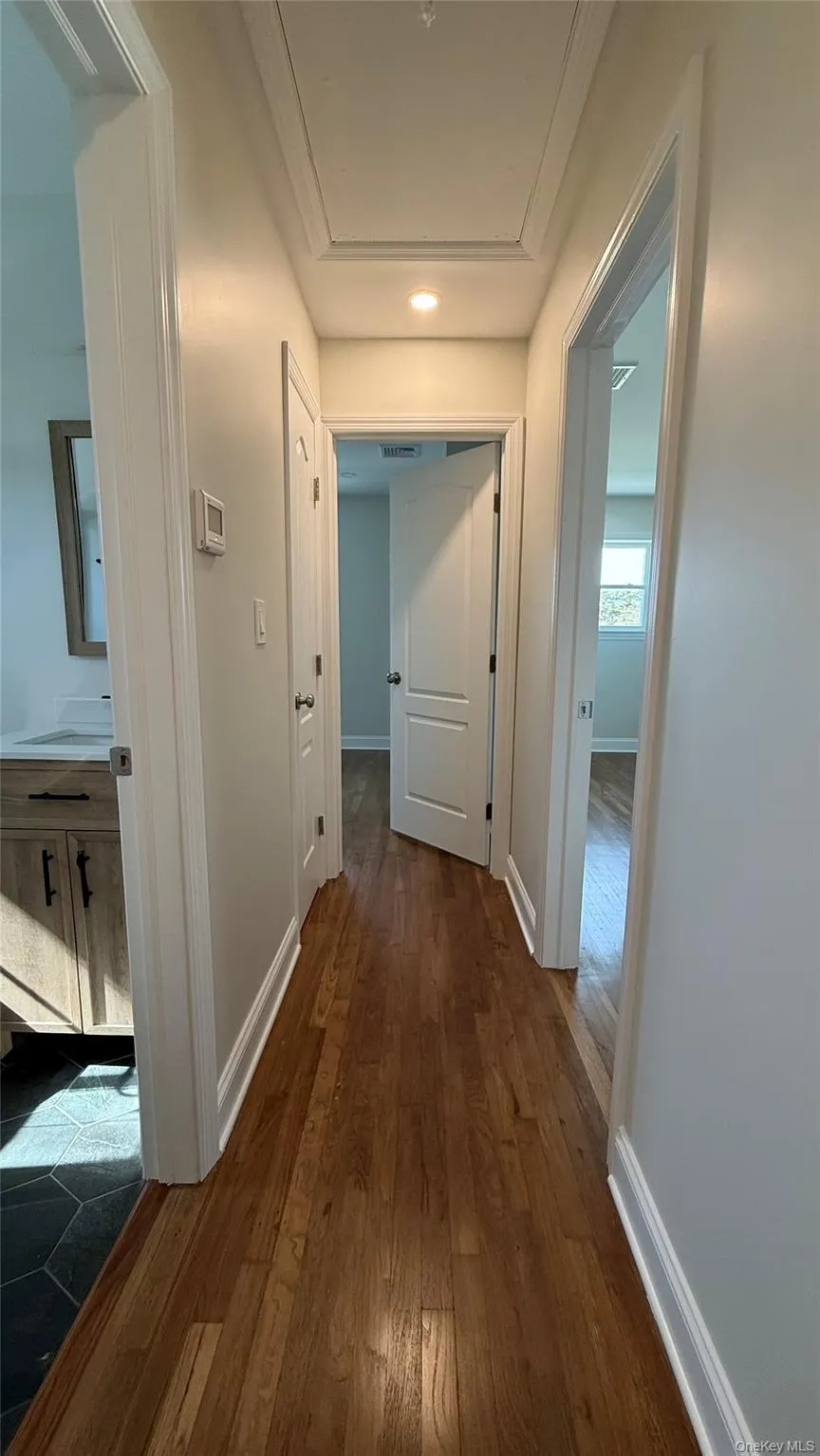 Second floor hallway with wood flooring and recessed lighting Second floor hallway with wood flooring and recessed lighting