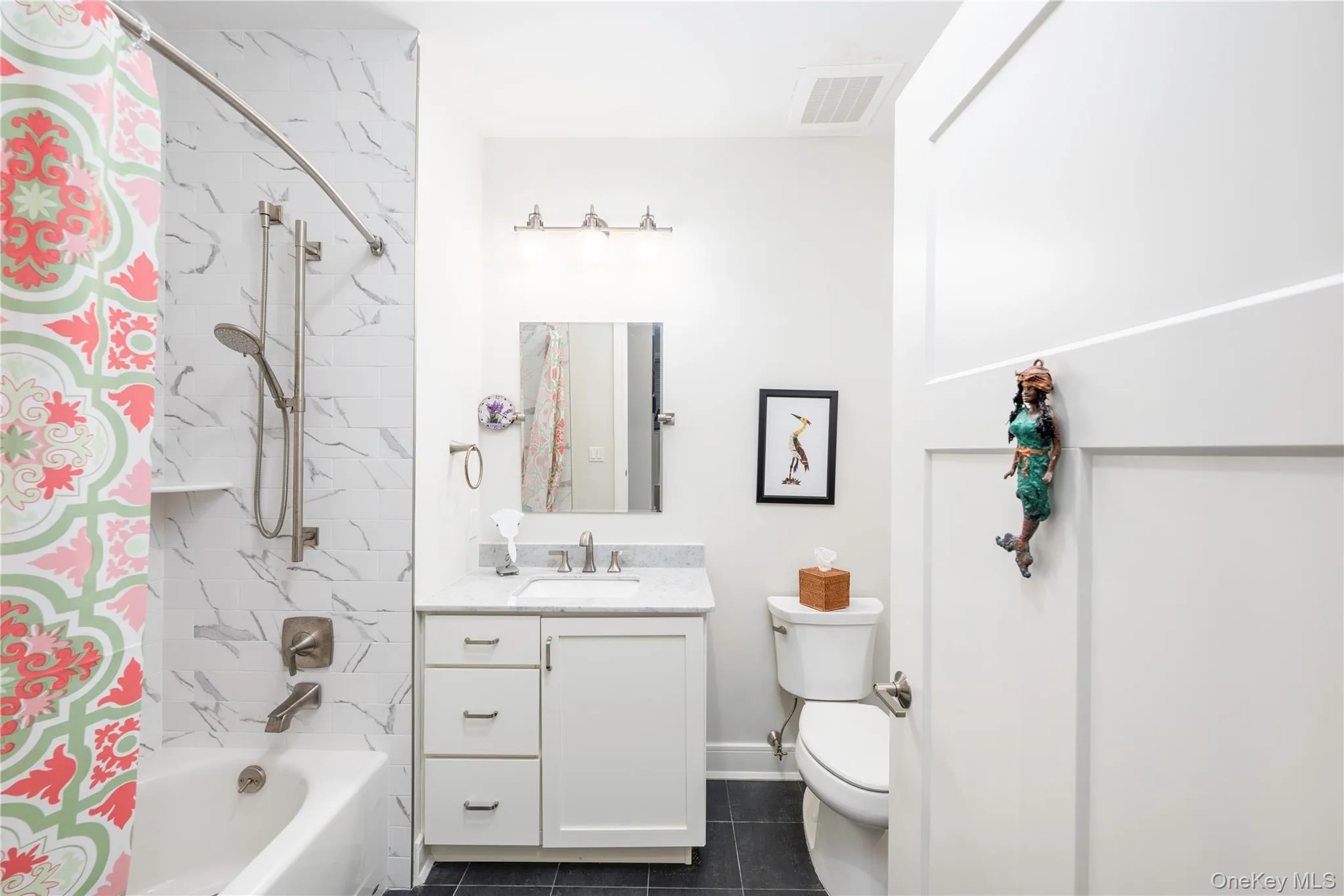 Guest bathroom with full tub. Guest bathroom with full tub.