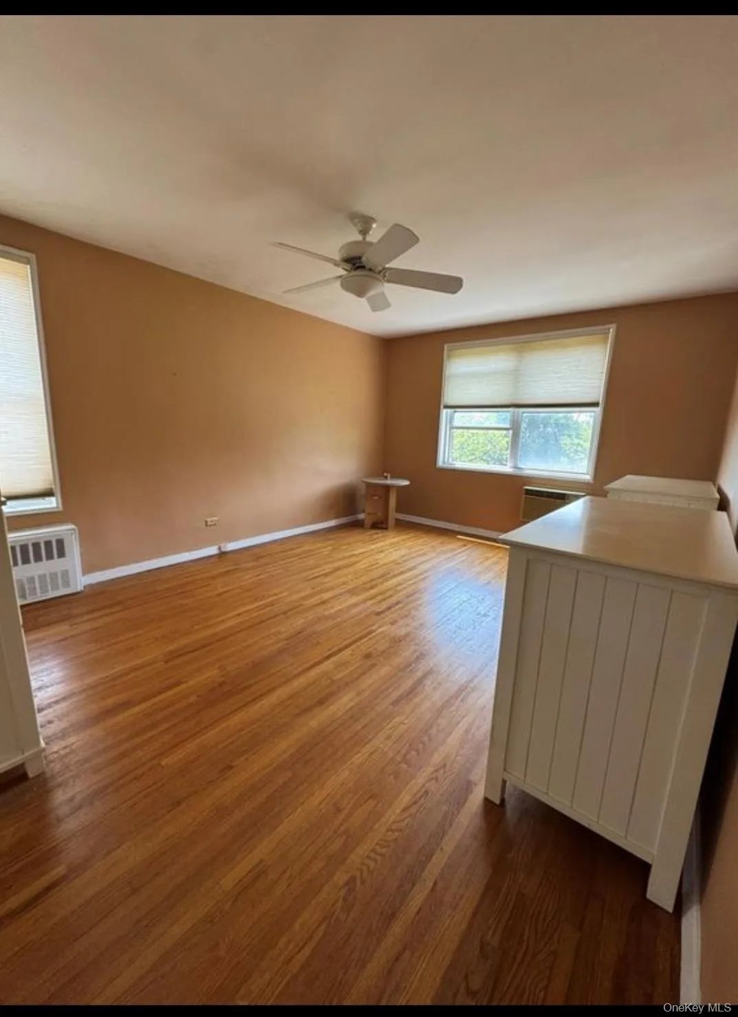 Spacious bedroom with hardwood floors , 3 windows and double closets Spacious bedroom with hardwood floors , 3 windows and double closets
