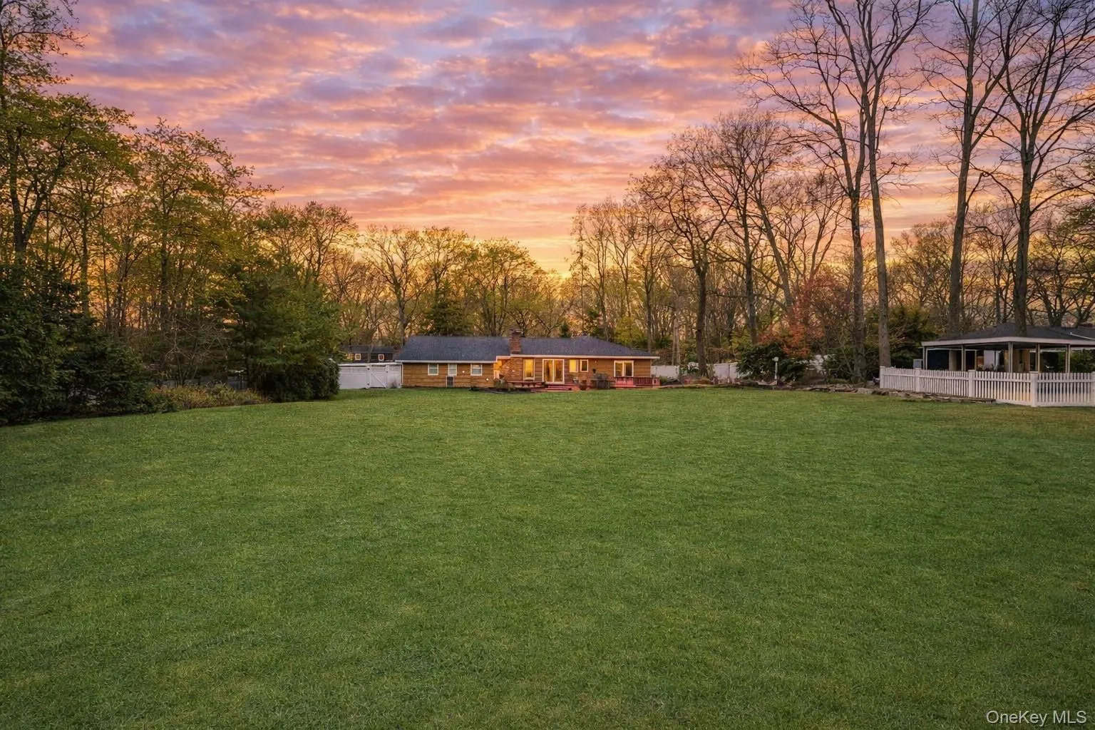View of grassy yard with view of scattered trees View of grassy yard with view of scattered trees