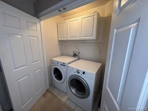 Laundry room with cabinet space, washer and dryer Laundry room with cabinet space, washer and dryer