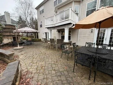 View of patio / terrace featuring outdoor dining space, a gazebo, french doors, and a fireplace View of patio / terrace featuring outdoor dining space, a gazebo, french doors, and a fireplace