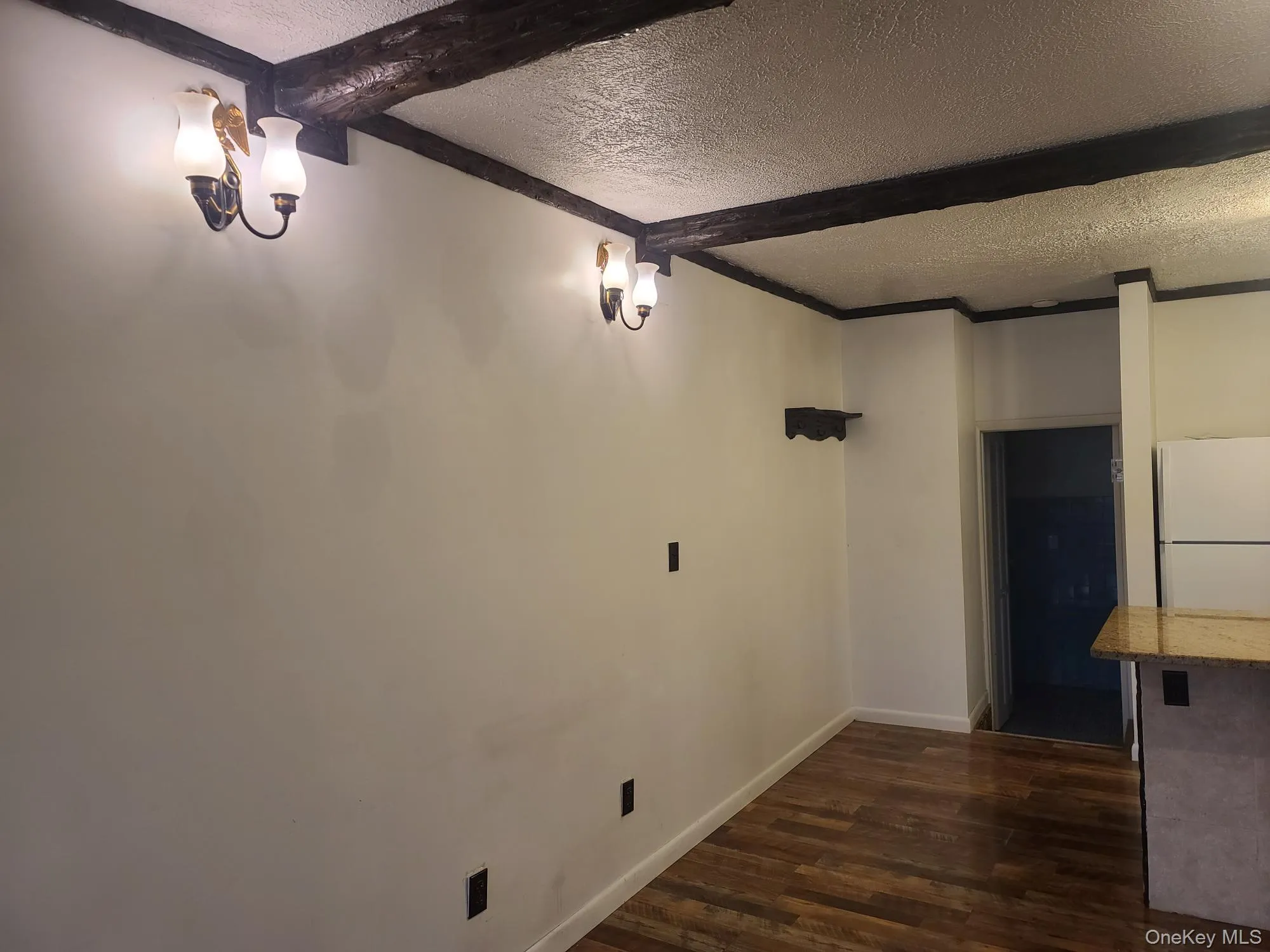 Wall sconces lead the way to the kitchen and bathroom Wall sconces lead the way to the kitchen and bathroom