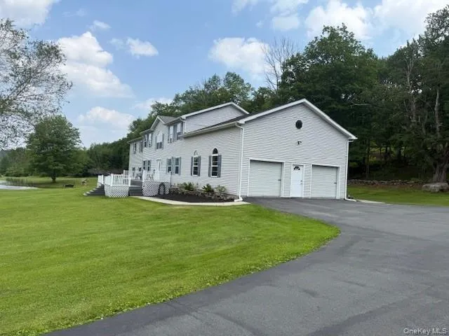 Garage with paved driveway Garage with paved driveway
