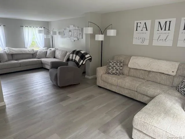 Livingroom area with light composite flooring Livingroom area with light composite flooring