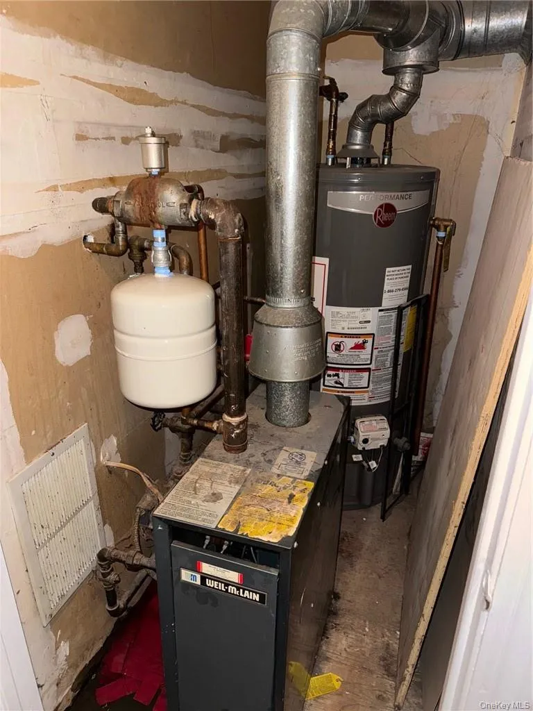 THE UNIT UTILITY ROOM INCLUDING THE BOILER AND HOT WATER TANK THE UNIT UTILITY ROOM INCLUDING THE BOILER AND HOT WATER TANK