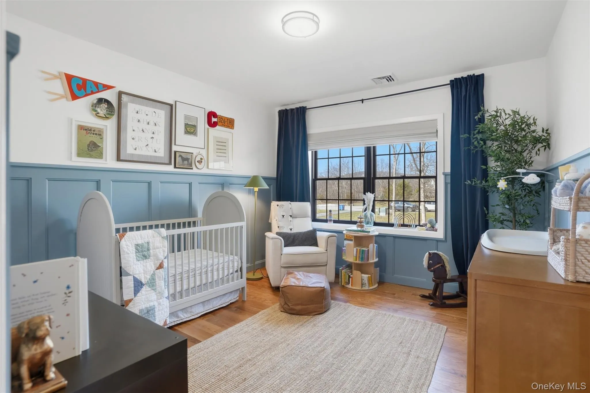 Spacious bedroom with hardwood floor, large window and good closet space Spacious bedroom with hardwood floor, large window and good closet space