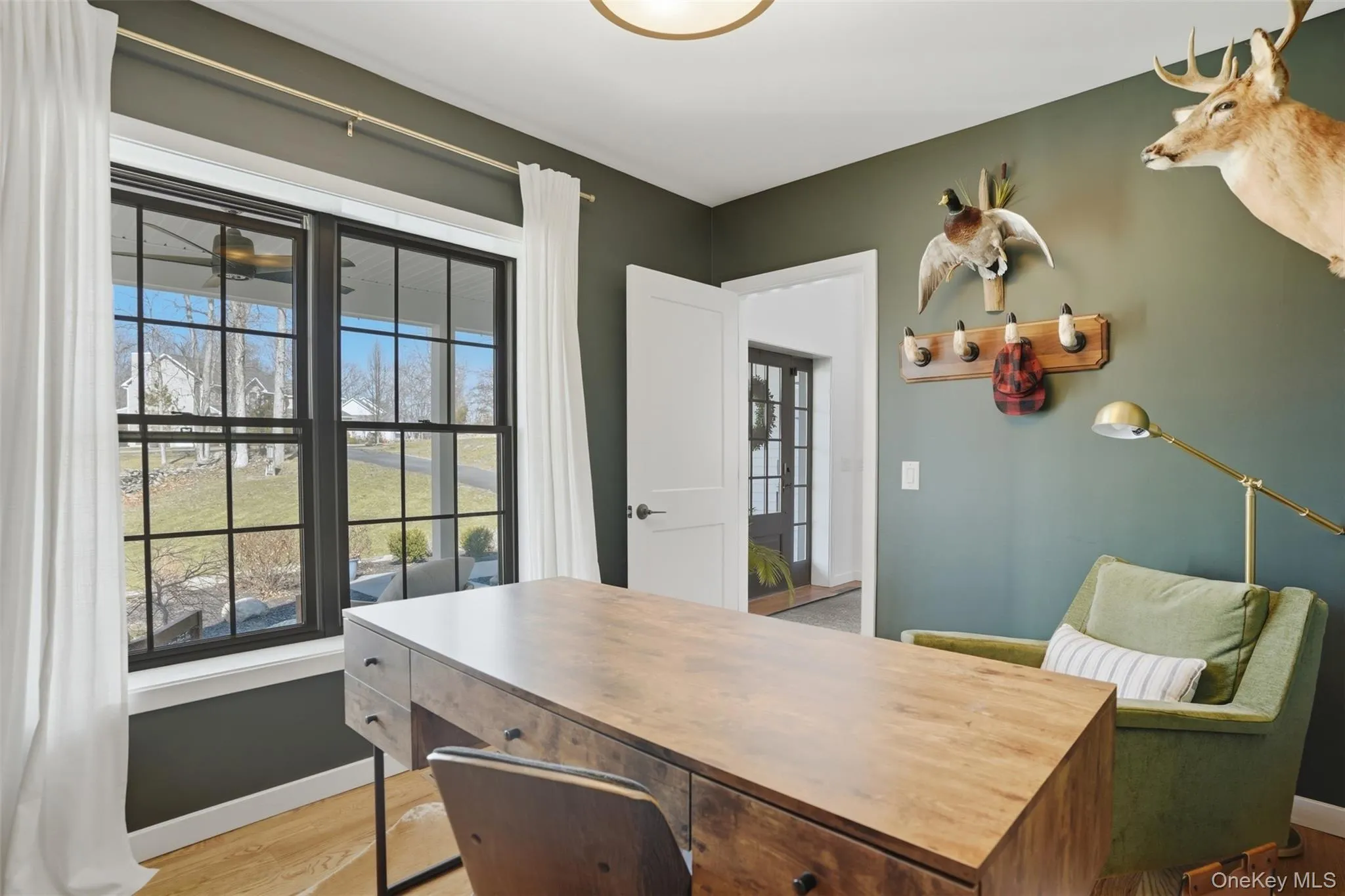 A handsome office off the front hallway is the perfect spot for a quiet workspace or library. A handsome office off the front hallway is the perfect spot for a quiet workspace or library.