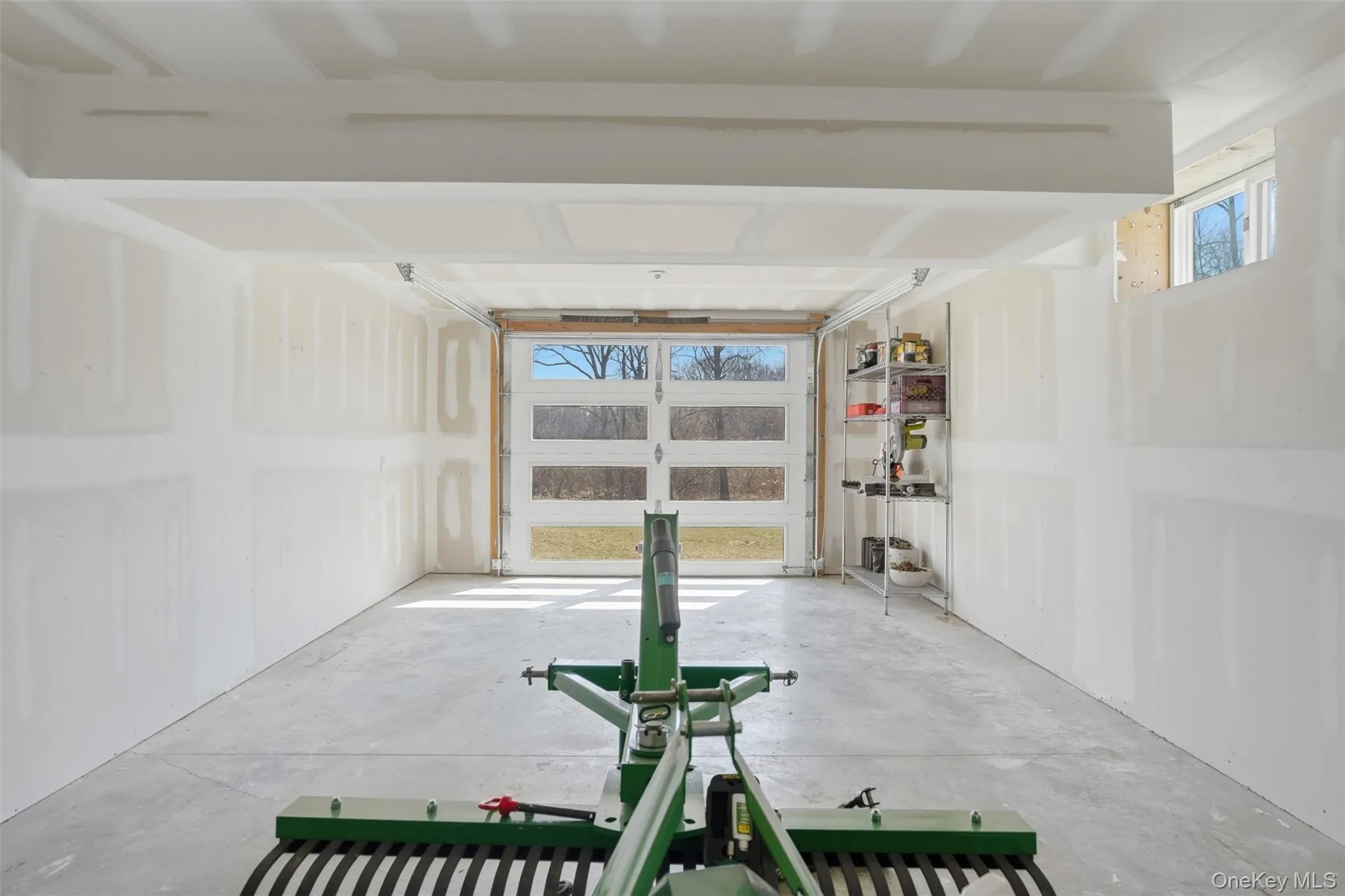 Bonus garage bay in the basement. In addition to the attached garage off the main level, the basement features a 3rd garage space for all your outdoor hobbies or a great game room! Bonus garage bay in the basement. In addition to the attached garage off the main level, the basement features a 3rd garage space for all your outdoor hobbies or a great game room!