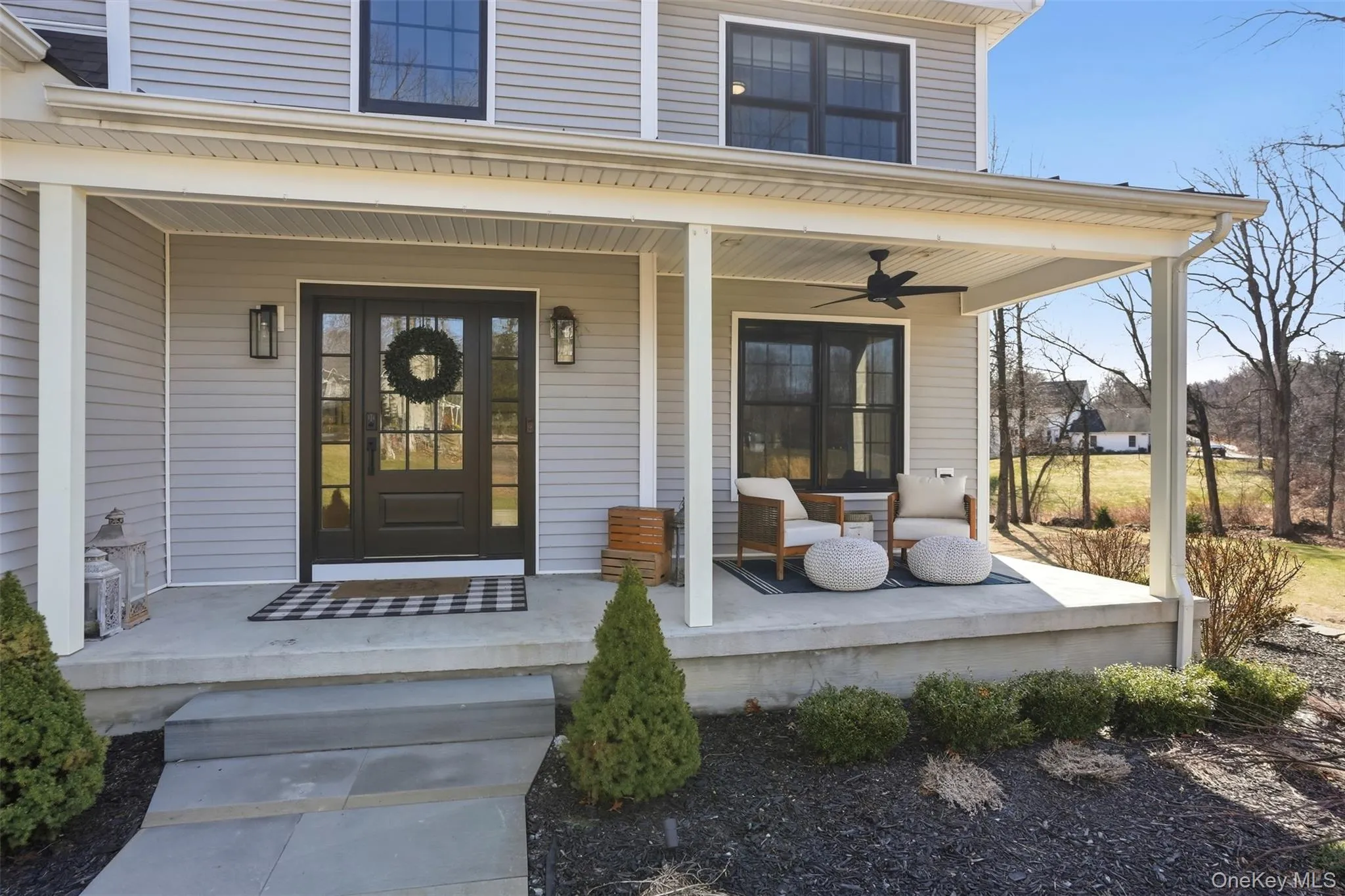 A covered front porch overlooking the front yard and quiet cul de sac. The perfect place to unwind and enjoy the lovely neighborhood. A covered front porch overlooking the front yard and quiet cul de sac. The perfect place to unwind and enjoy the lovely neighborhood.