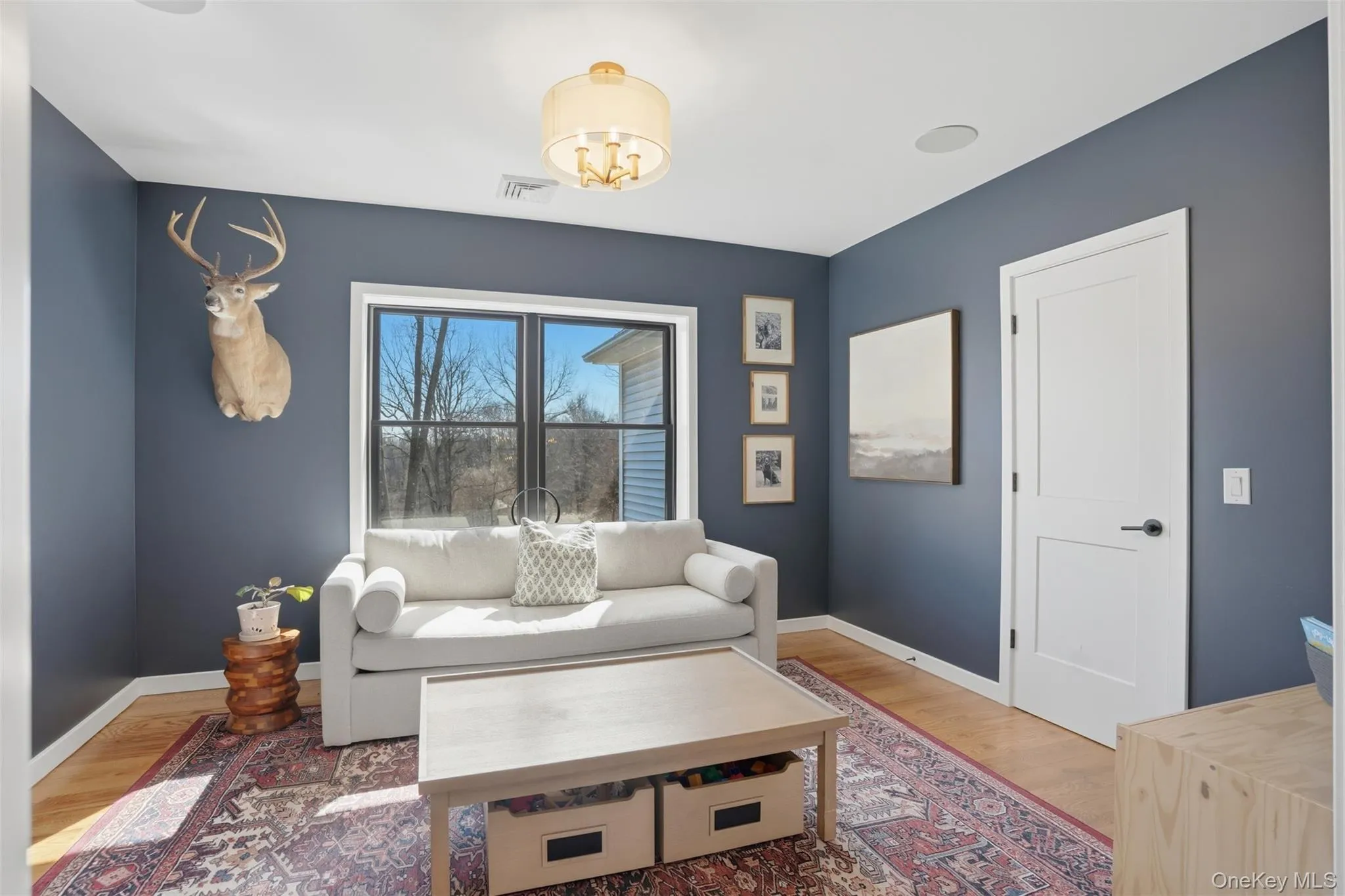 Currently being used as a playroom and additional sitting area, this bedroom has a closet, hardwood floors and large window Currently being used as a playroom and additional sitting area, this bedroom has a closet, hardwood floors and large window