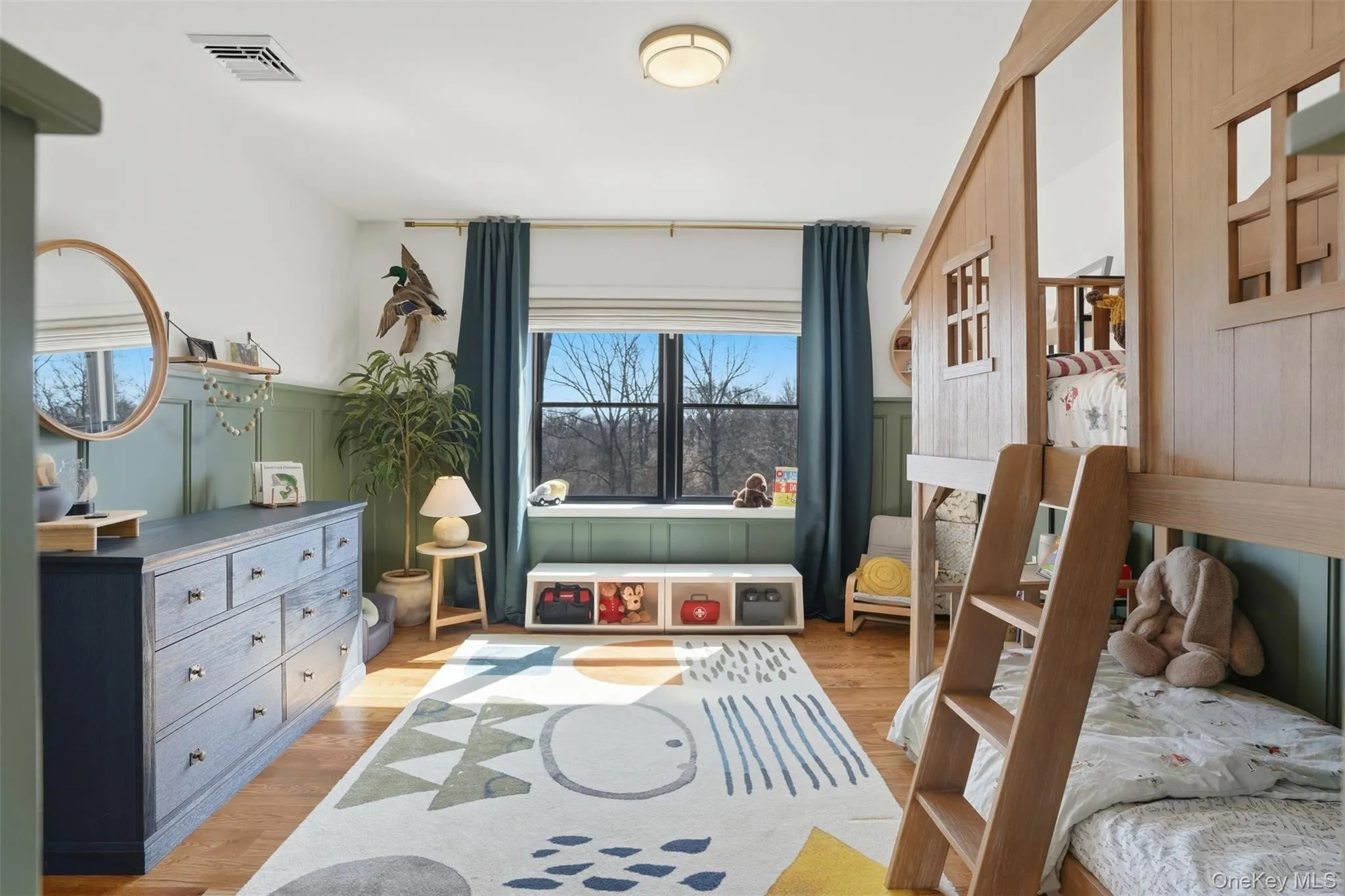 Picture perfect bedroom with hardwood floors, large windows and closet Picture perfect bedroom with hardwood floors, large windows and closet
