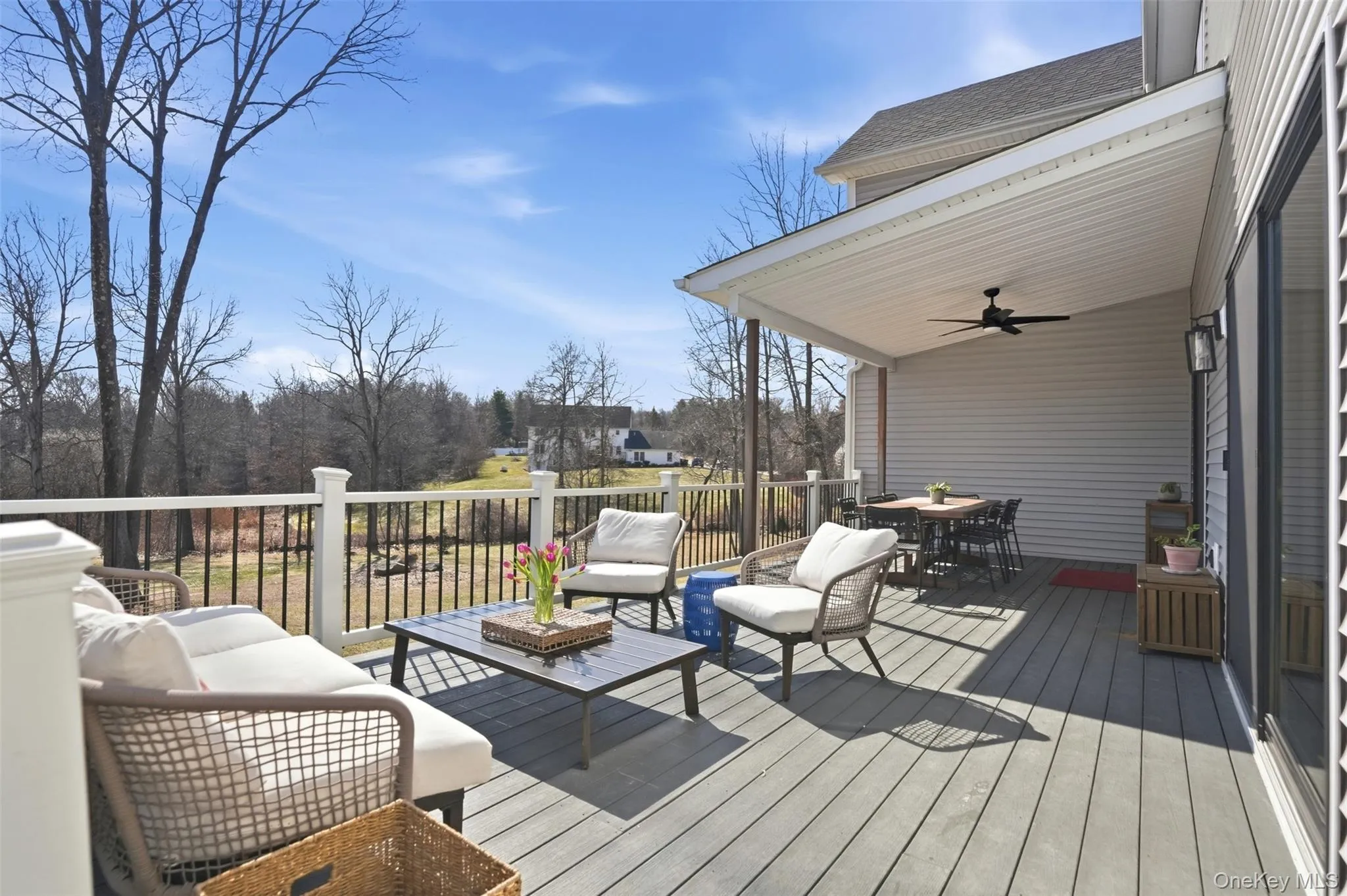 A composite deck with overhang for shade and ceiling fan make this a comfortable extension of living space, outdoors. Overlooking the 1.9 acres, retention pond and pickleball court. A composite deck with overhang for shade and ceiling fan make this a comfortable extension of living space, outdoors. Overlooking the 1.9 acres, retention pond and pickleball court.