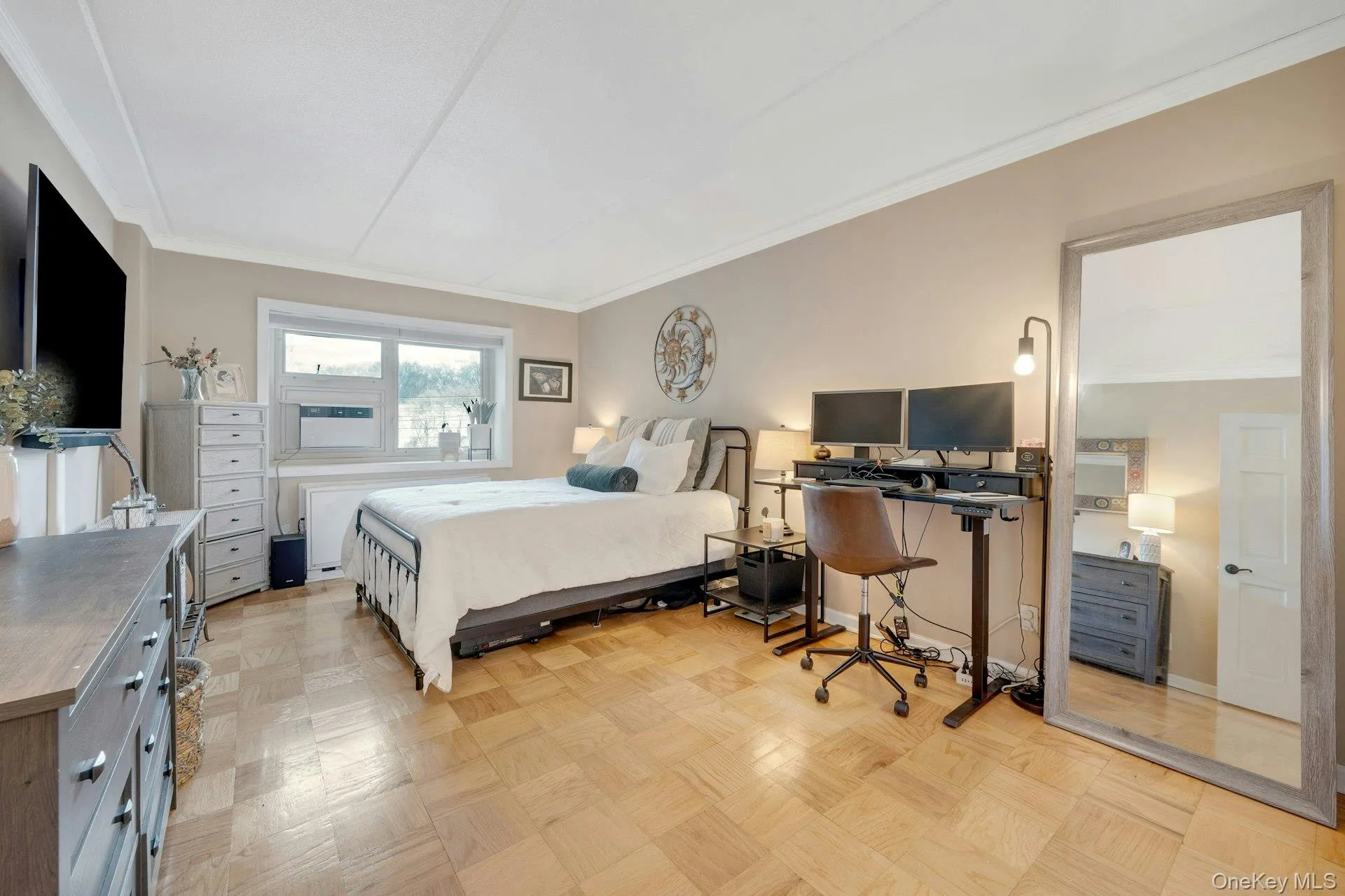 Oversized primary bedroom, great natural light. Wall mounted TV included. Oversized primary bedroom, great natural light. Wall mounted TV included.