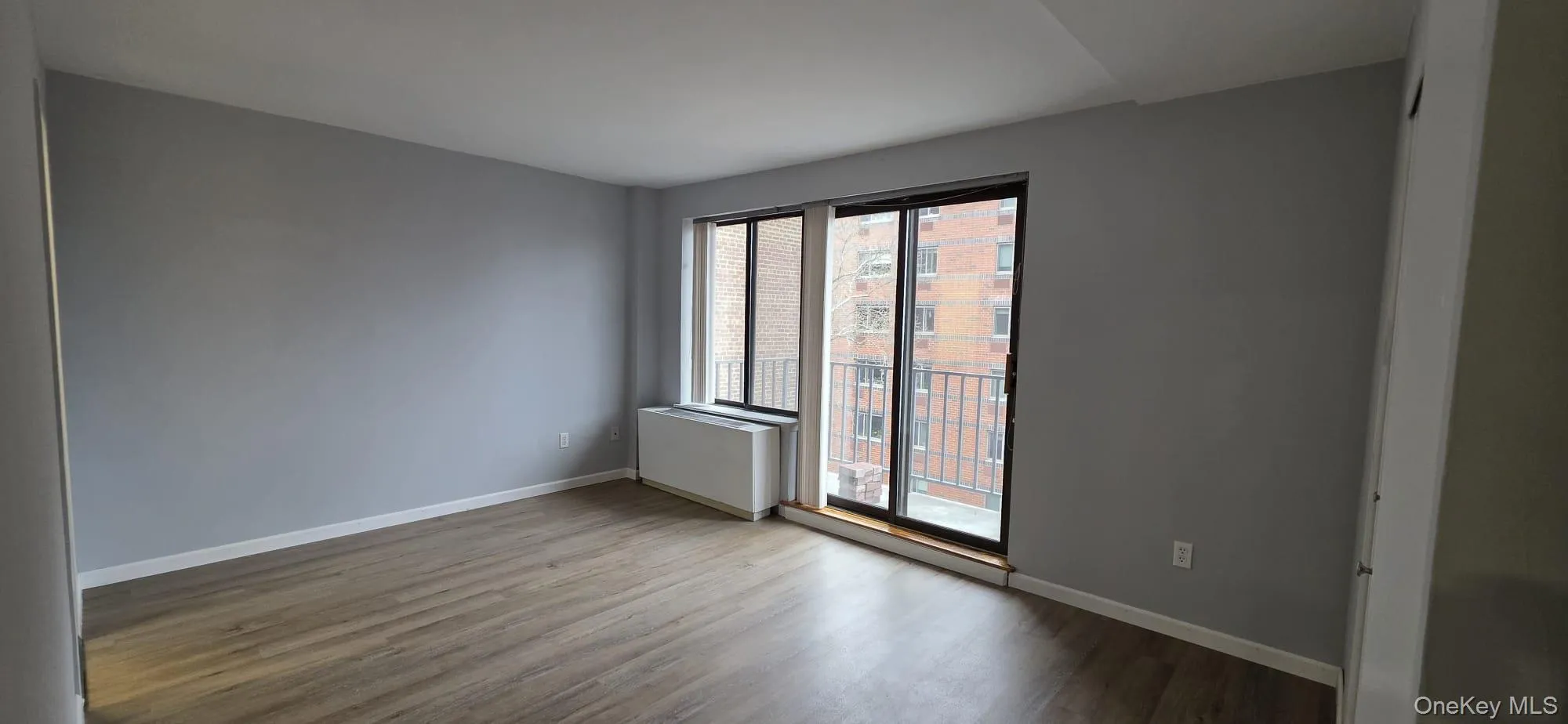 Primary bedroom, door leads to private balcony. Primary bedroom, door leads to private balcony.