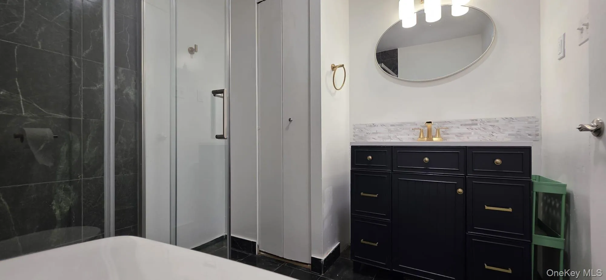 Ensuite with shower stall and linen closet Ensuite with shower stall and linen closet