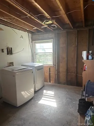 Laundry area featuring washer and clothes dryer Laundry area featuring washer and clothes dryer