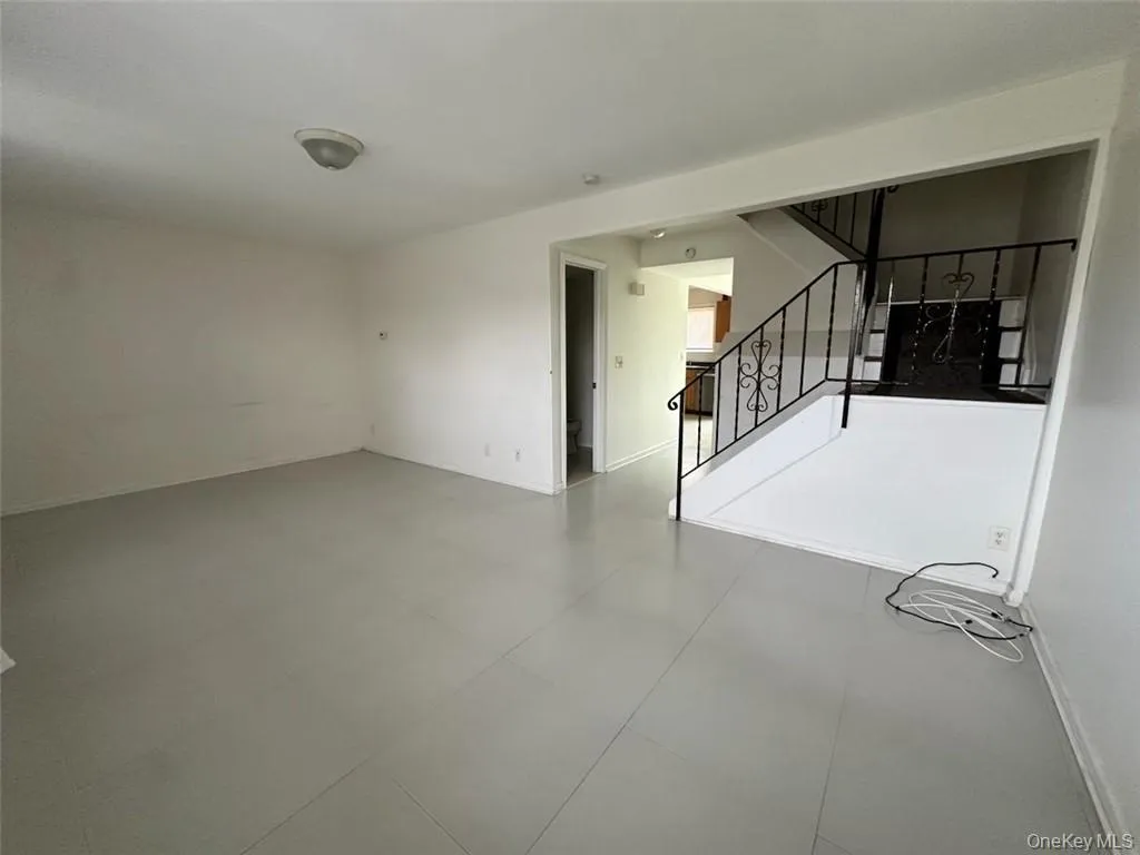 Enter into a large, bright living room. Enter into a large, bright living room.