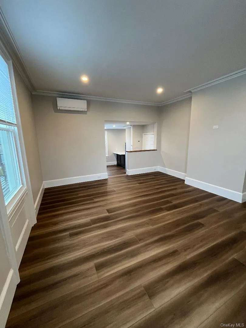 Another view of the living room looking into kitchen. Another view of the living room looking into kitchen.