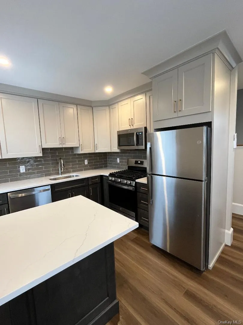 Another view of the kitchen with stainless steel appliances. Another view of the kitchen with stainless steel appliances.