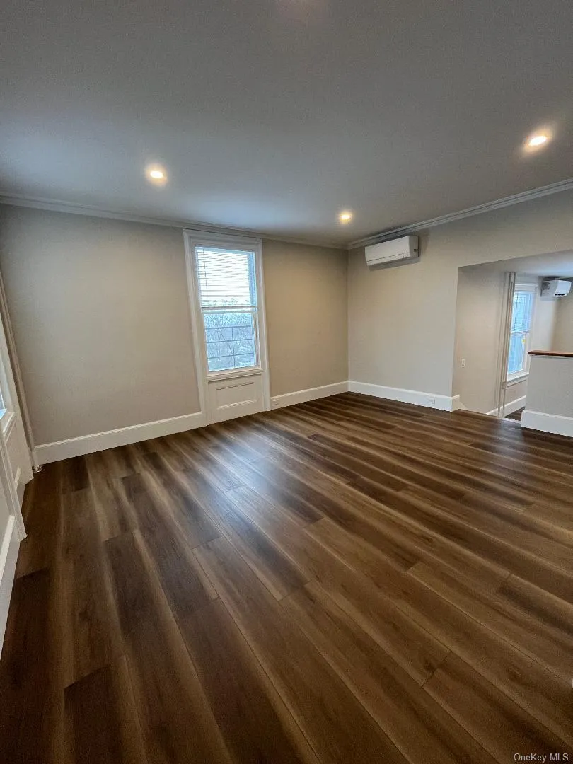 The living room offering distant water views with oversized windows bringing in the natural sunlight. The living room offering distant water views with oversized windows bringing in the natural sunlight.