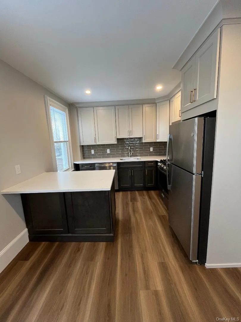 Chef-inspired kitchen complete with brand-new stainless-steel appliances, quartzite countertops, and an oversized quartzite island—ideal for cooking and entertaining. Chef-inspired kitchen complete with brand-new stainless-steel appliances, quartzite countertops, and an oversized quartzite island—ideal for cooking and entertaining.