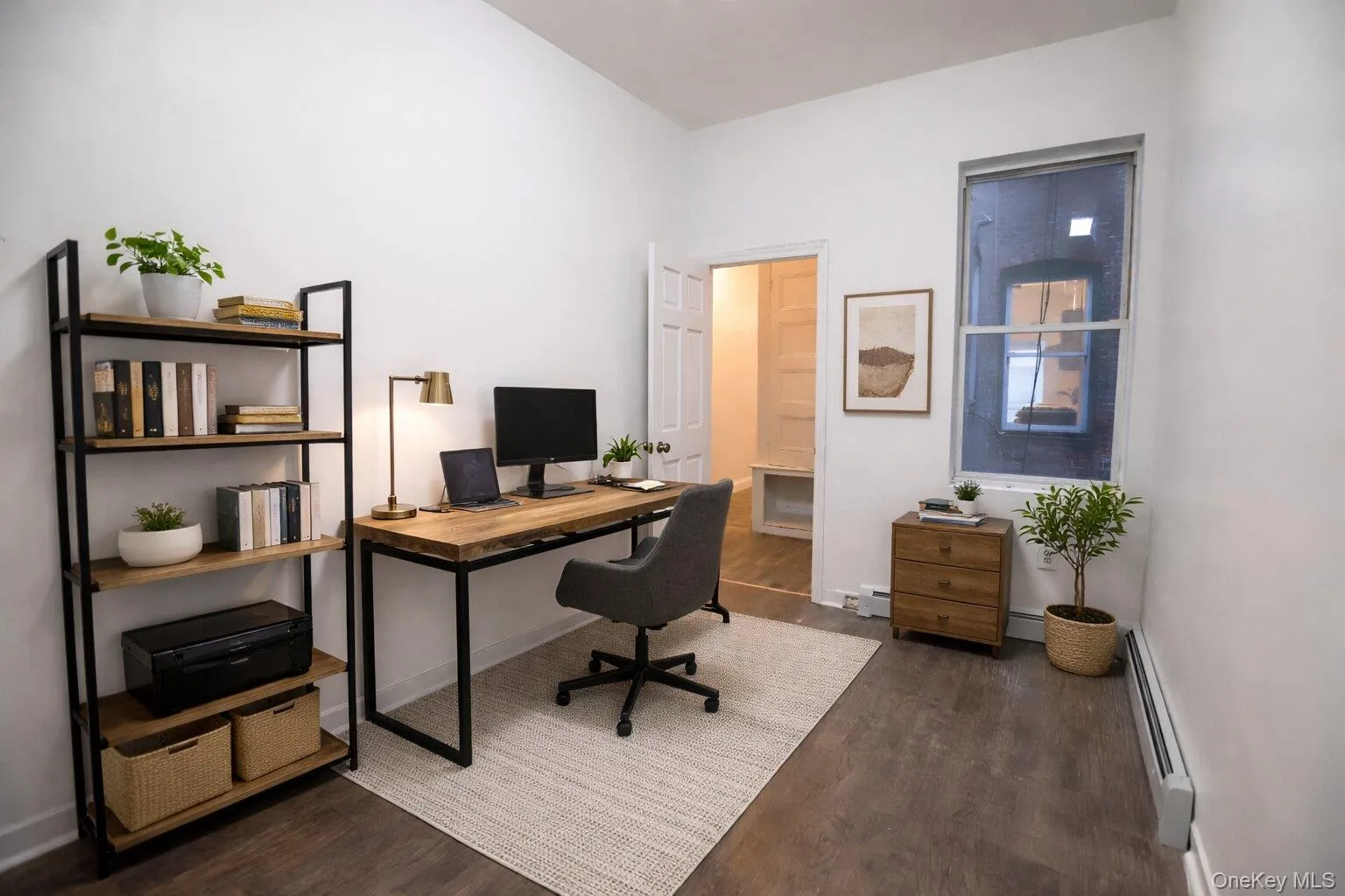 Virtually staged home office with hardwood style flooring and a bright white wall finish Virtually staged home office with hardwood style flooring and a bright white wall finish