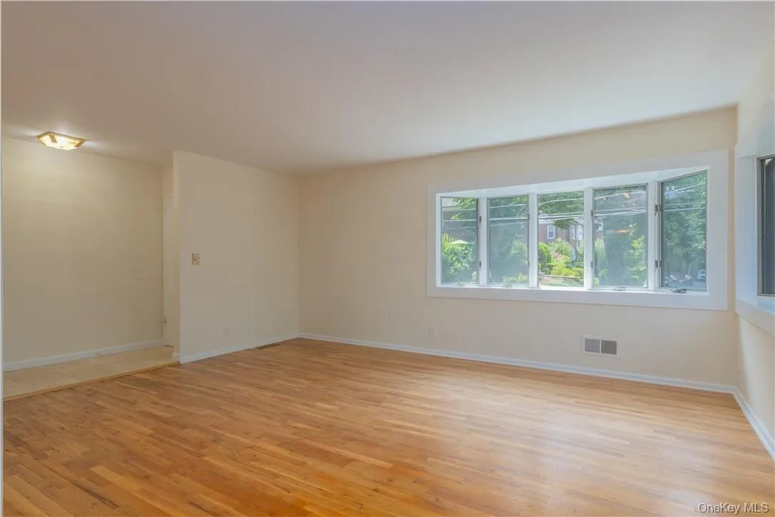 Spare room with light hardwood / wood-style flooring Spare room with light hardwood / wood-style flooring