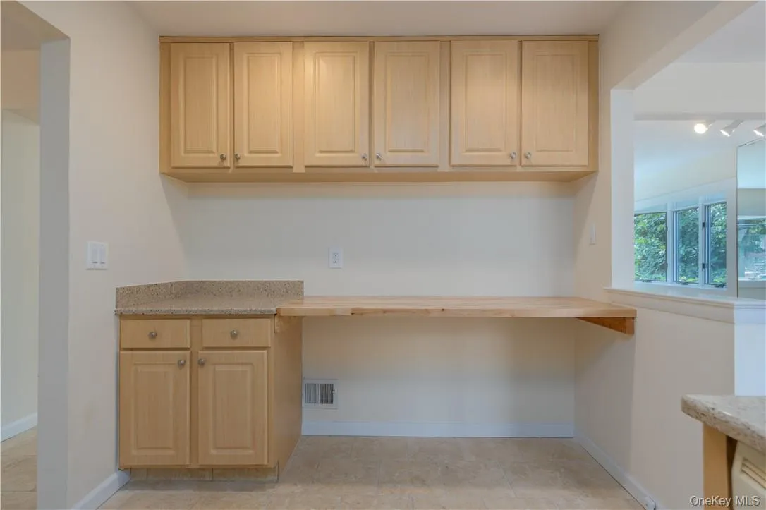 Unfurnished office featuring light tile patterned flooring Unfurnished office featuring light tile patterned flooring