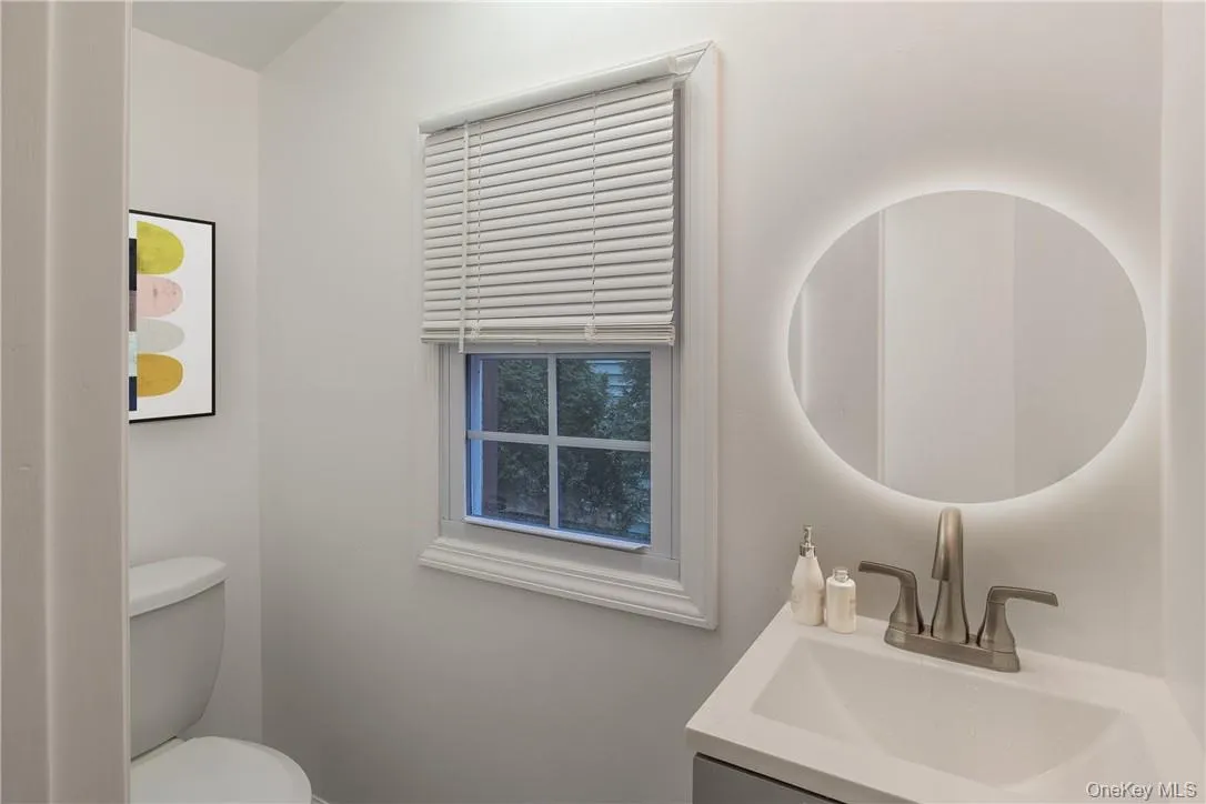 Bathroom featuring vanity and toilet Bathroom featuring vanity and toilet