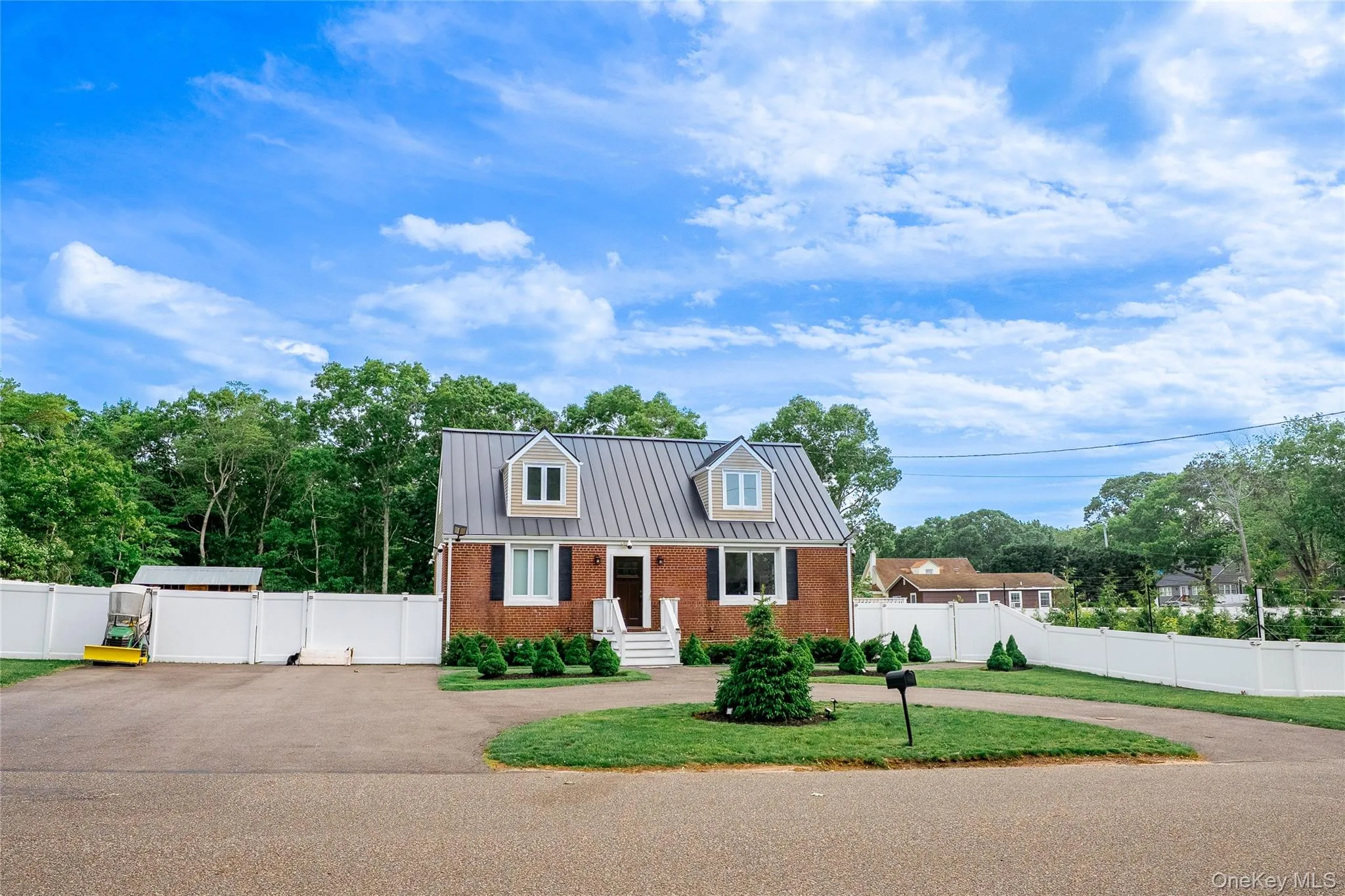 Property offers a circular driveway, plus an additional side driveway for added parking and convenience. Property offers a circular driveway, plus an additional side driveway for added parking and convenience.