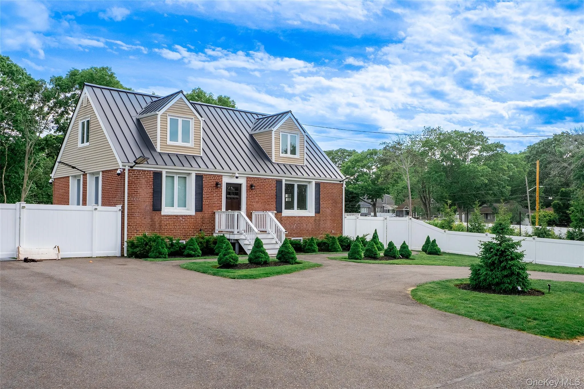 Property offers a circular driveway, plus an additional side driveway for added parking and convenience. Property offers a circular driveway, plus an additional side driveway for added parking and convenience.