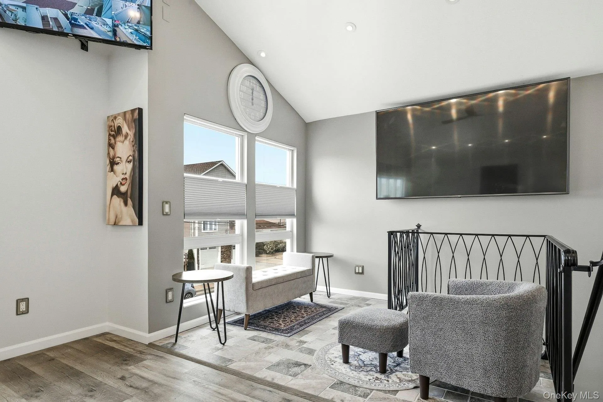 Living area featuring vaulted ceiling Living area featuring vaulted ceiling