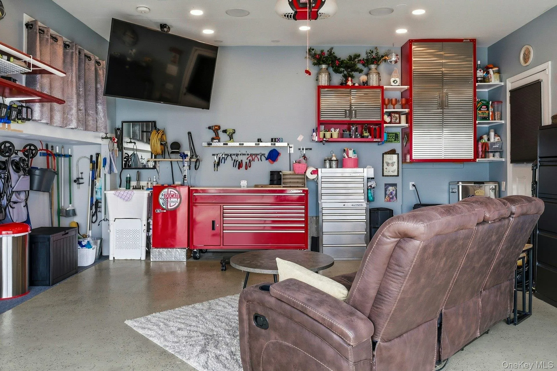 Garage featuring a workshop area, recessed lighting, Epoxy floor . Heating and cooling . Garage featuring a workshop area, recessed lighting, Epoxy floor . Heating and cooling .