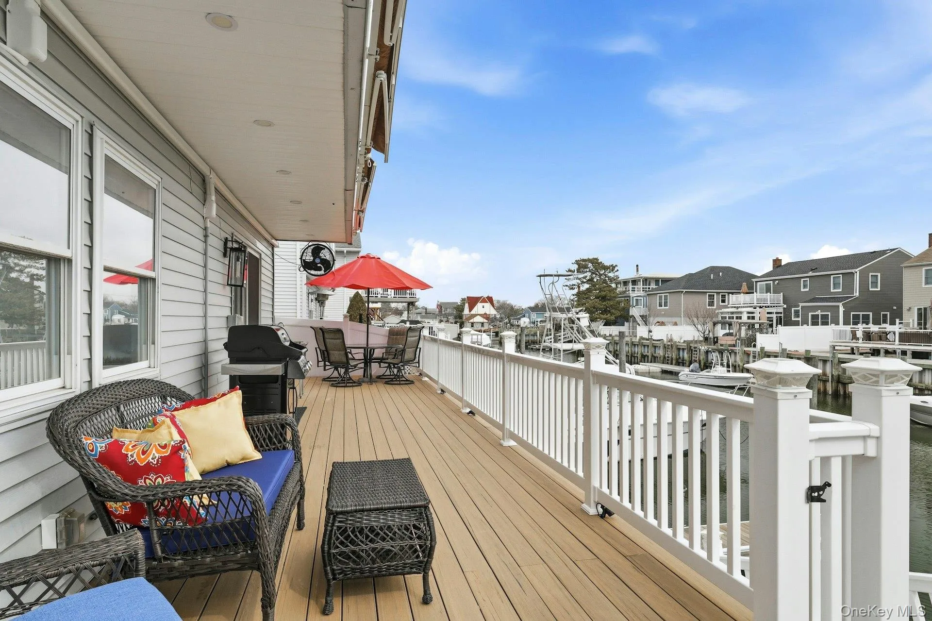 Wooden deck with area for grilling, outdoor dining space Wooden deck with area for grilling, outdoor dining space