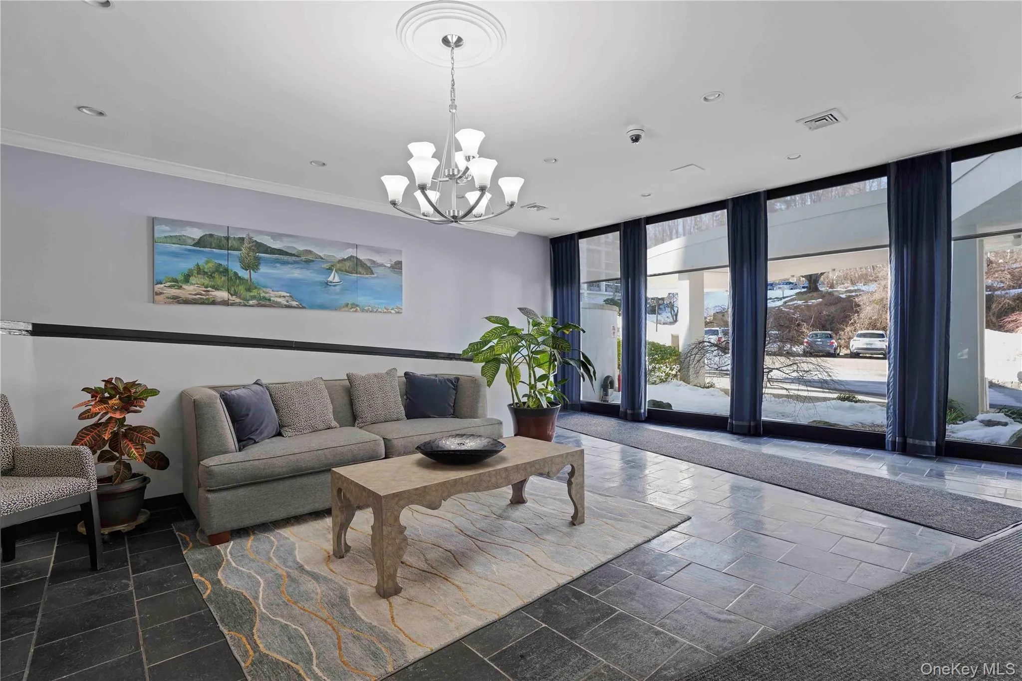 With walls of glass, the lobby is bright and cheerful and offers a ram With walls of glass, the lobby is bright and cheerful and offers a ram